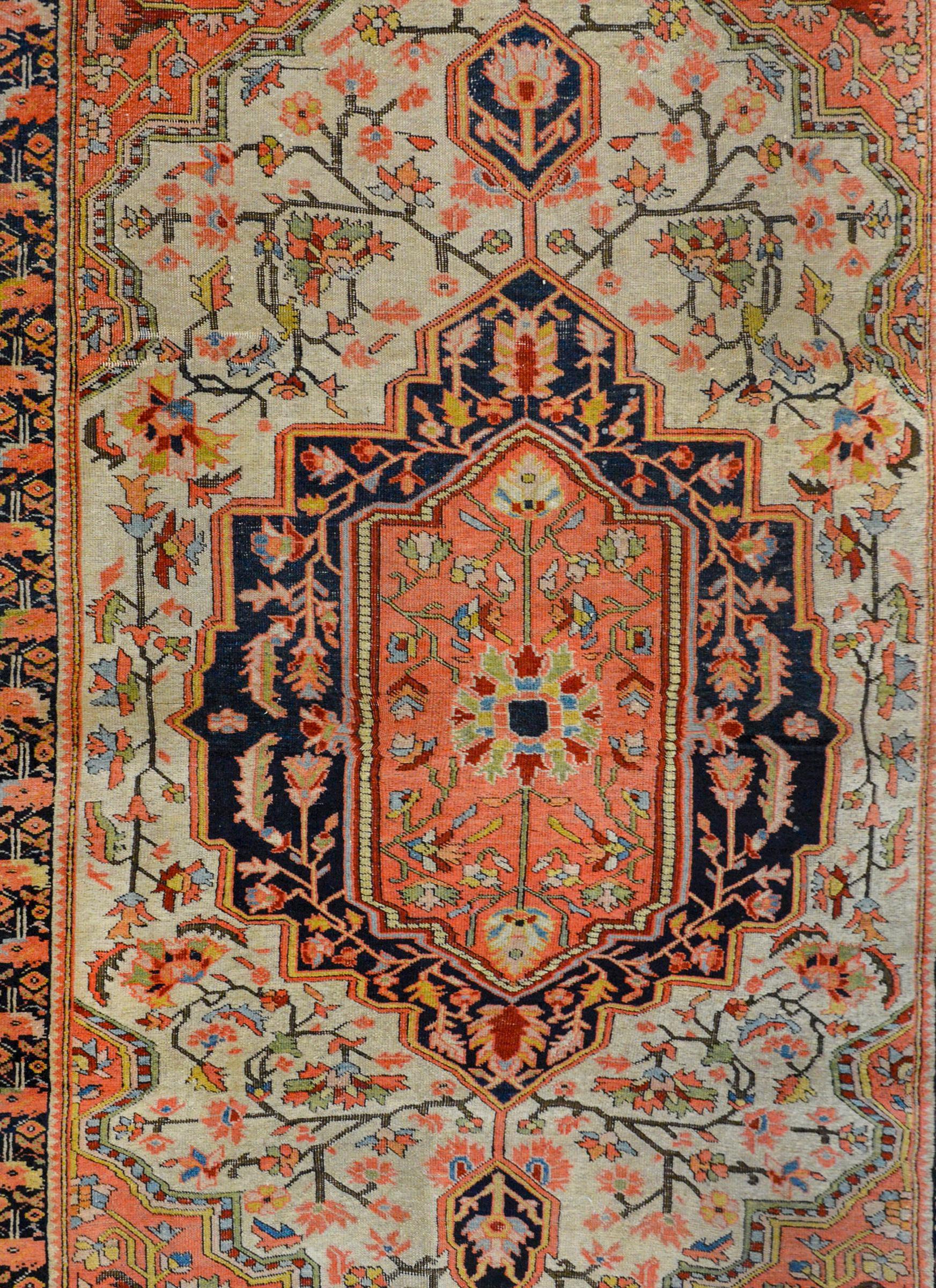 A wild early 20th century Persian Sarouk Farahan rug with fantastic pattern containing multiple medallions with myriad scrolling vines and flowers on coral, indigo, and white backgrounds surrounded by a beautiful stylized floral and scrolling vine
