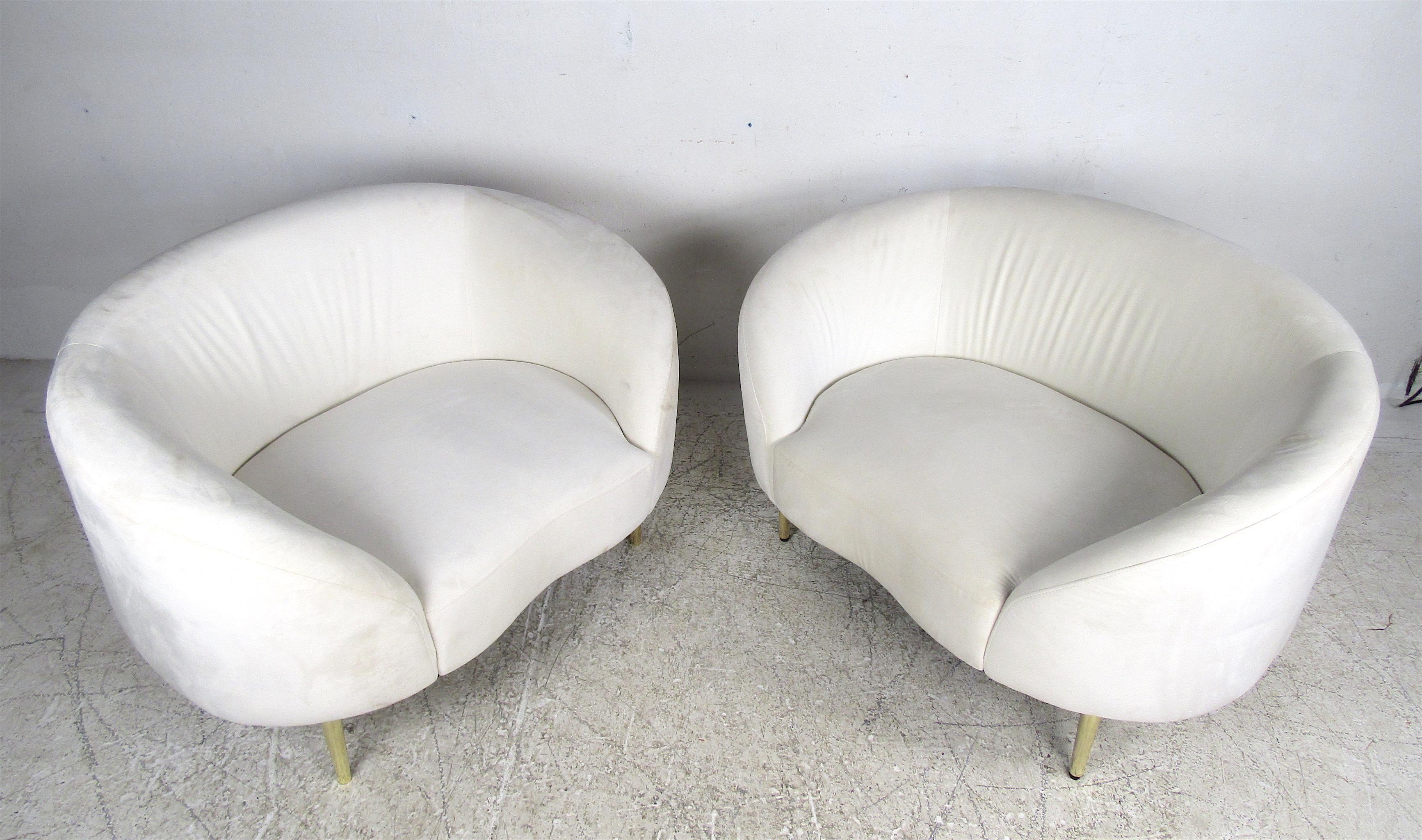 This stunning pair of vintage modern chairs feature splayed brass legs and original white velvet upholstery. A comfortable and sleek design that makes these incredibly desirable. The perfect fit for any home, business, or office. Please confirm the