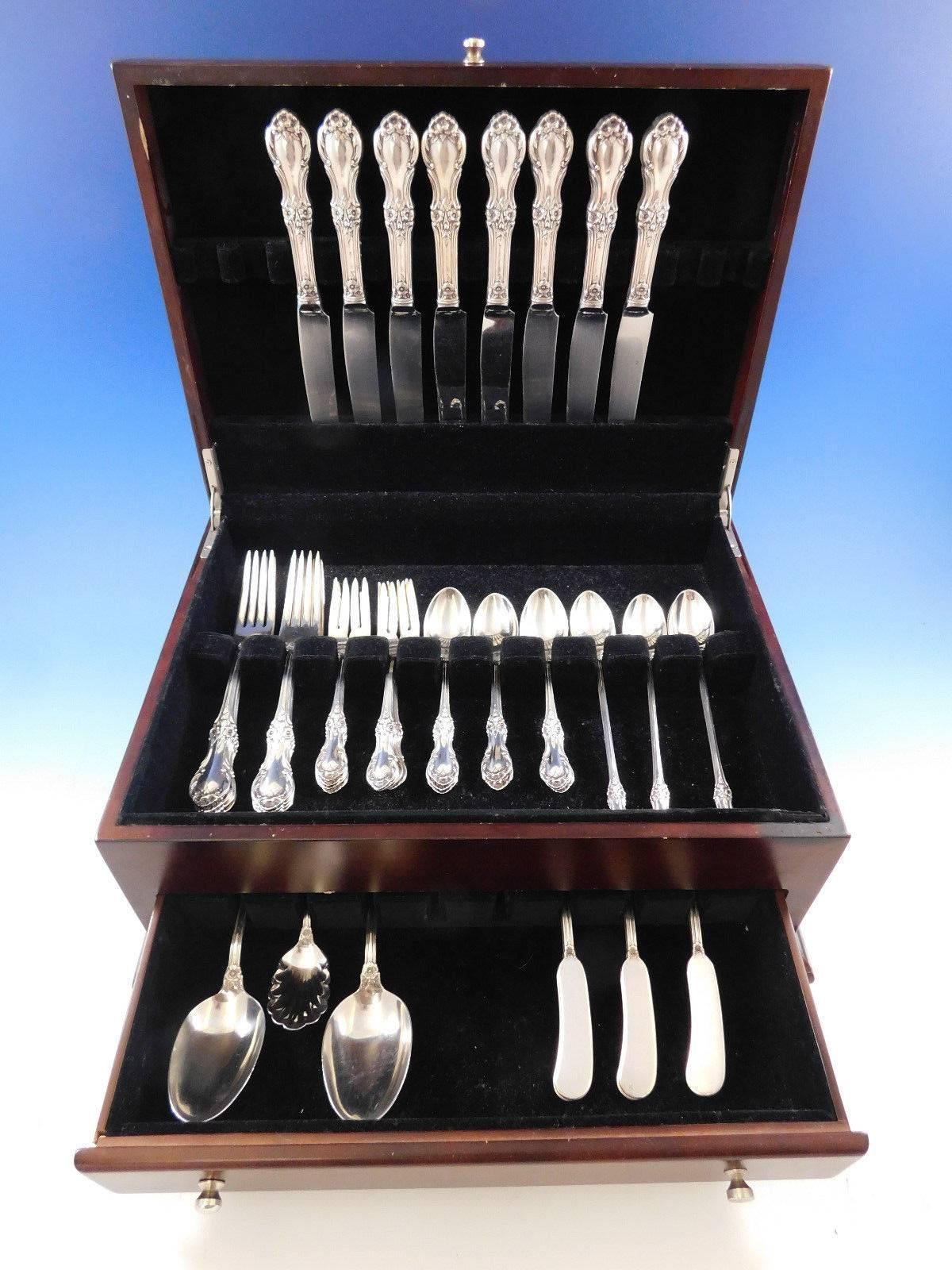 Dinner size Wild Rose by International sterling silver flatware set of 51 pieces. This set includes: 

Eight dinner size knives, 9 5/8
