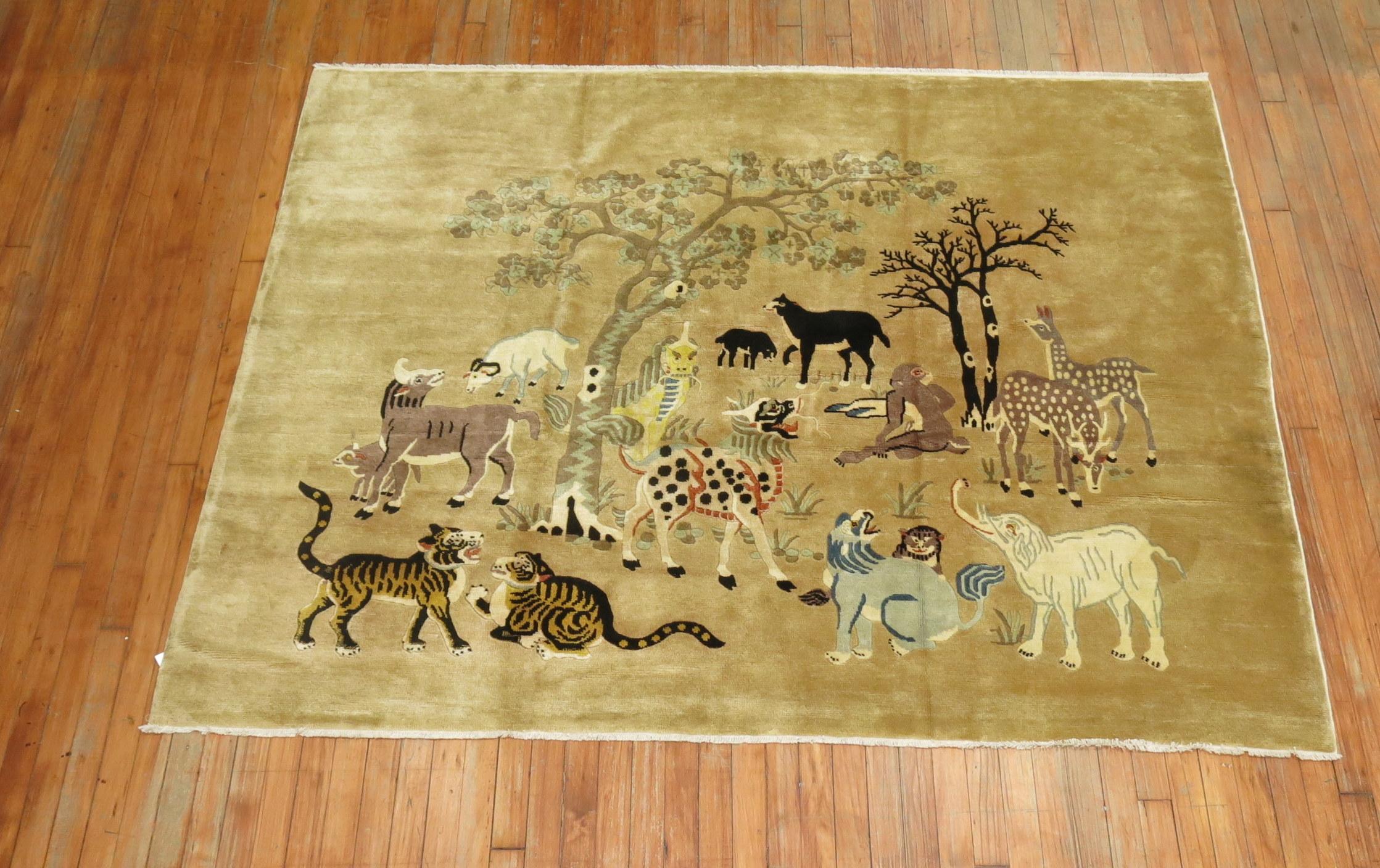 Mid-20th century Chinese pictorial rug featuring animals from a wild safari.