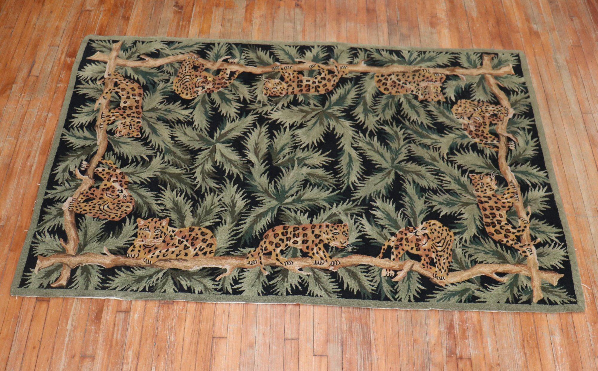 A late 20th century one of a kind Hooked Rug with 10 cheetahs on a 4 long branches on a green and black large leaf pattern

Measures: 5' x 8'.
  