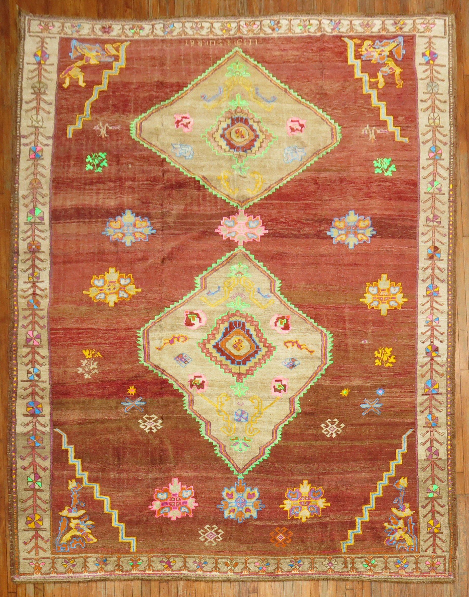 Wild room size Turkish kars rug from the middle of the 20th century. 2 medallions on a brown field, accents in neon green, electric blue, sunny yellow, pumpkin orange and bright pinks
A statement piece might be best to start your room around the