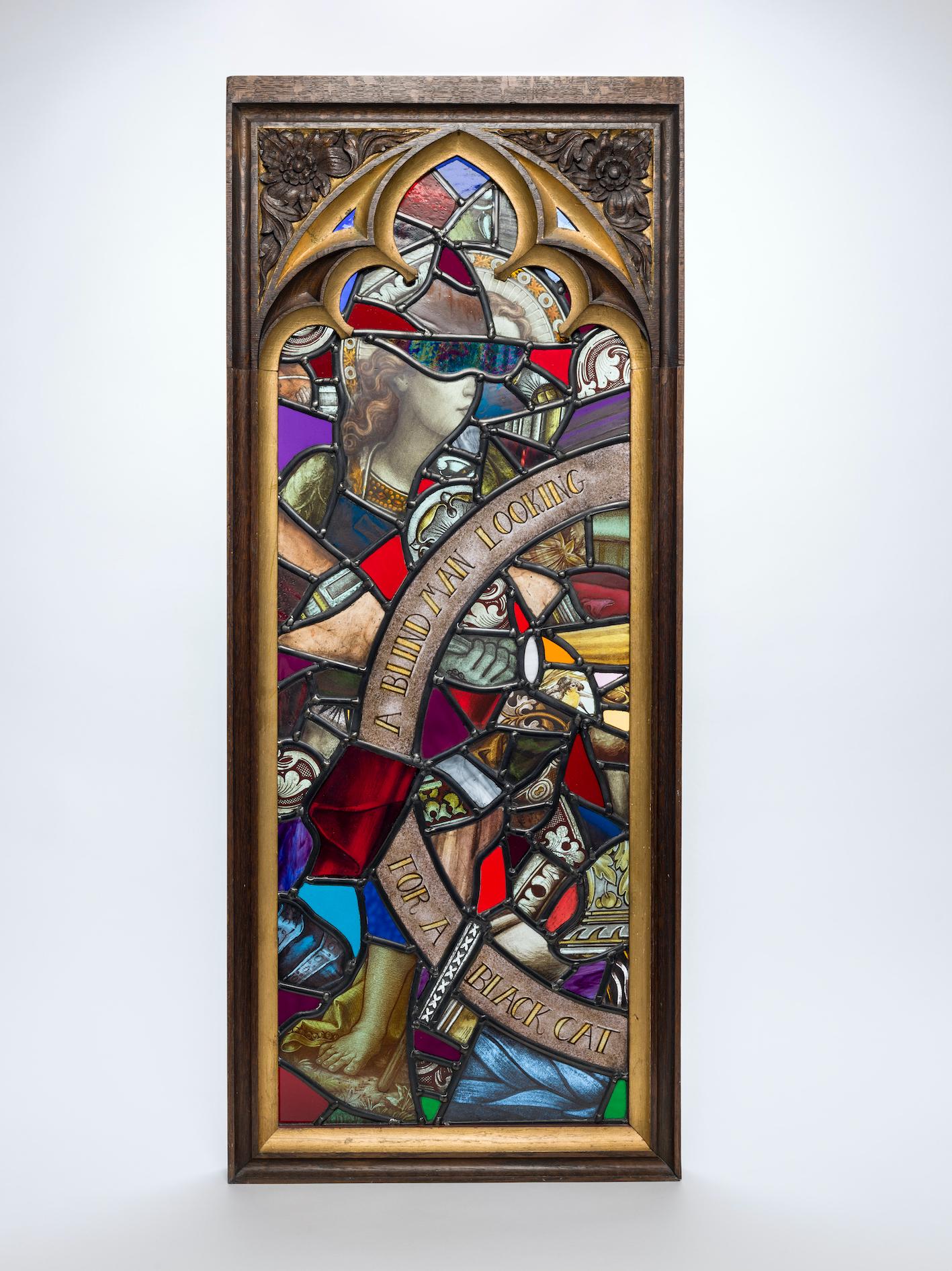 Stained glass trilogy depicting Christ shining a torch after a quote from Oscar Wilde:
‘Religion is like blind man looking in a black room for a black cat that isn’t there and finding it’
This triptych has been re-worked using antique and stained