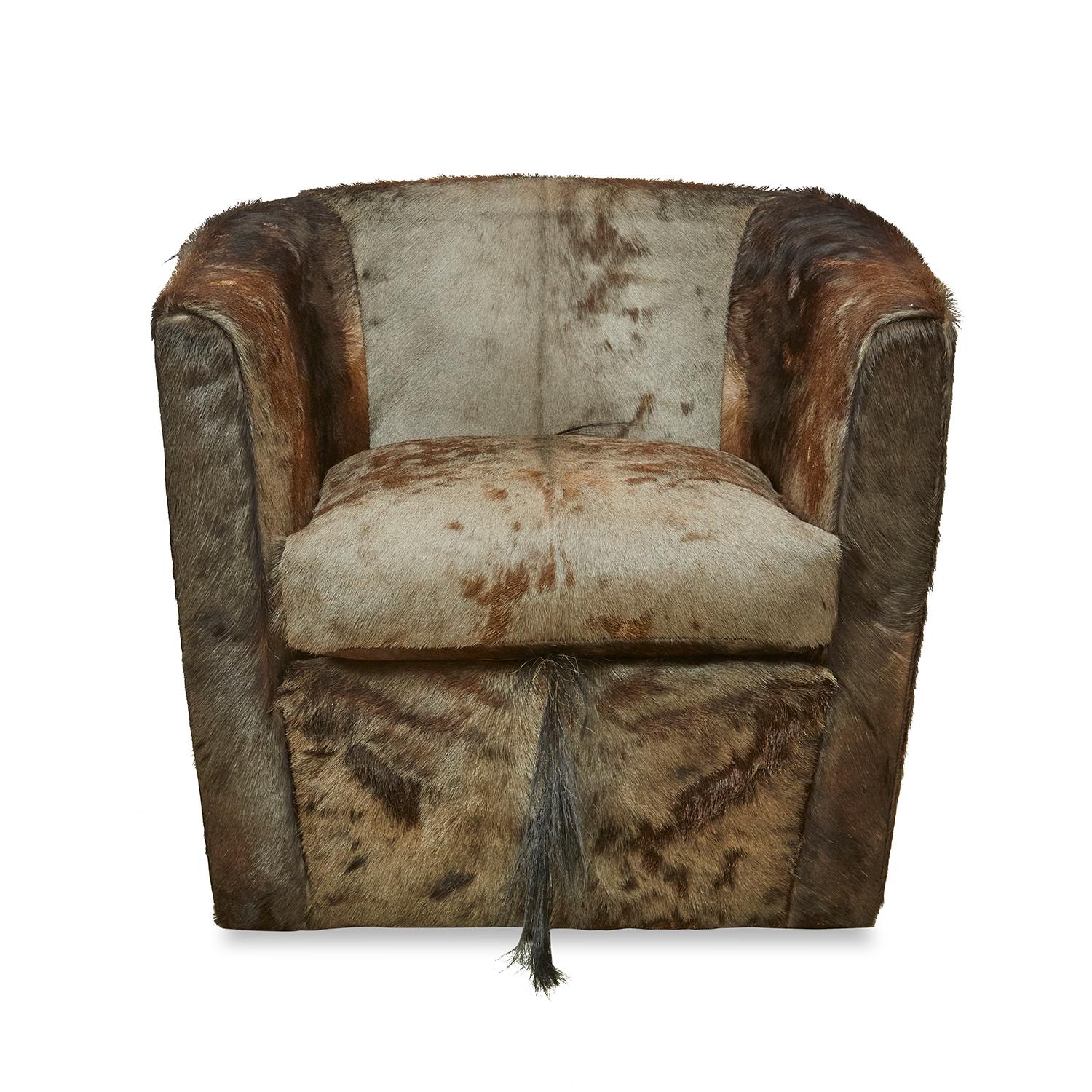 Genuine Blue Wildebeest hide creates an occasional chair sure to make a statement. Each chair requires four full hides to upholster and manufacture making every chair one-of-a-kind. Due to the use of natural materials, each piece is unique and may