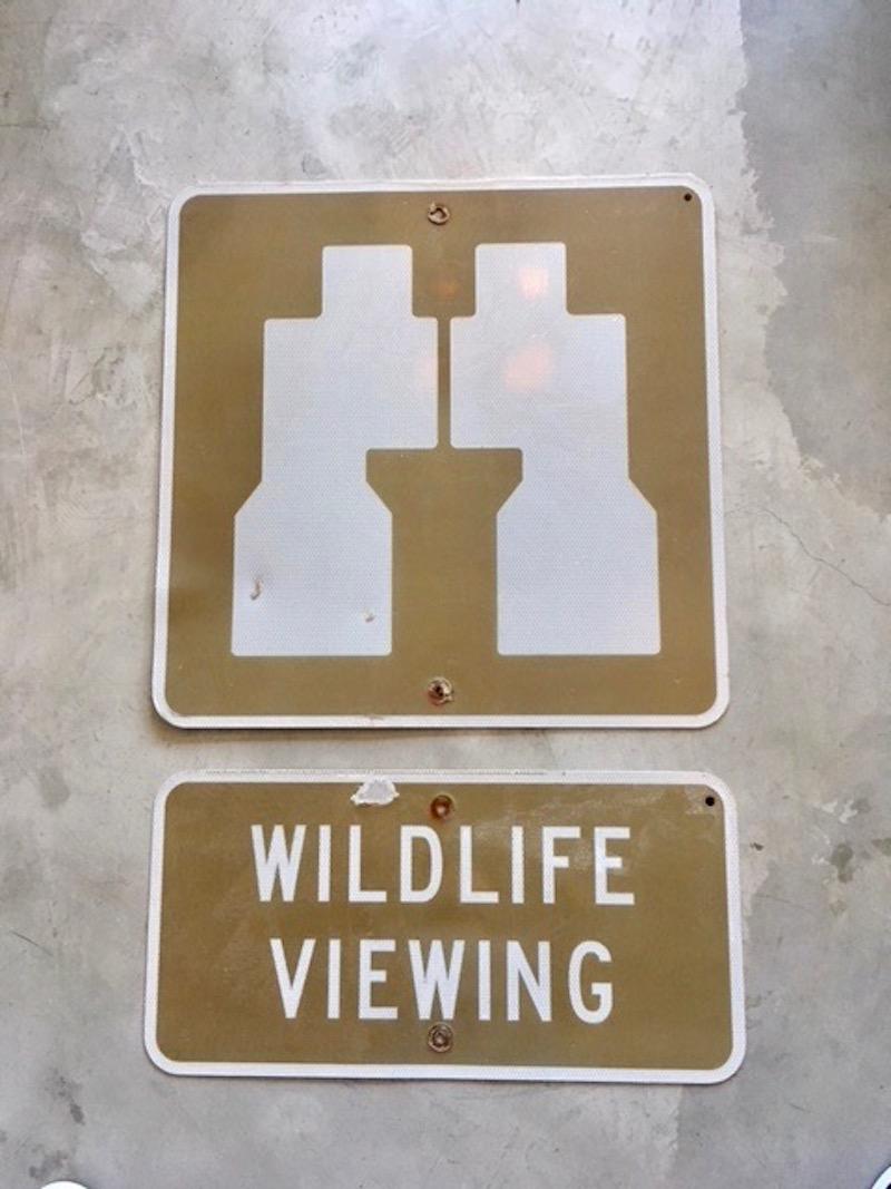 Vintage WILDLIFE VIEWING sign from a state park. Two signs. One larger sign depicting a pair of binoculars. Smaller sign with WILDLIFE VIEWING. Brown and white. Interesting and rare pair of signs. Good vintage condition.