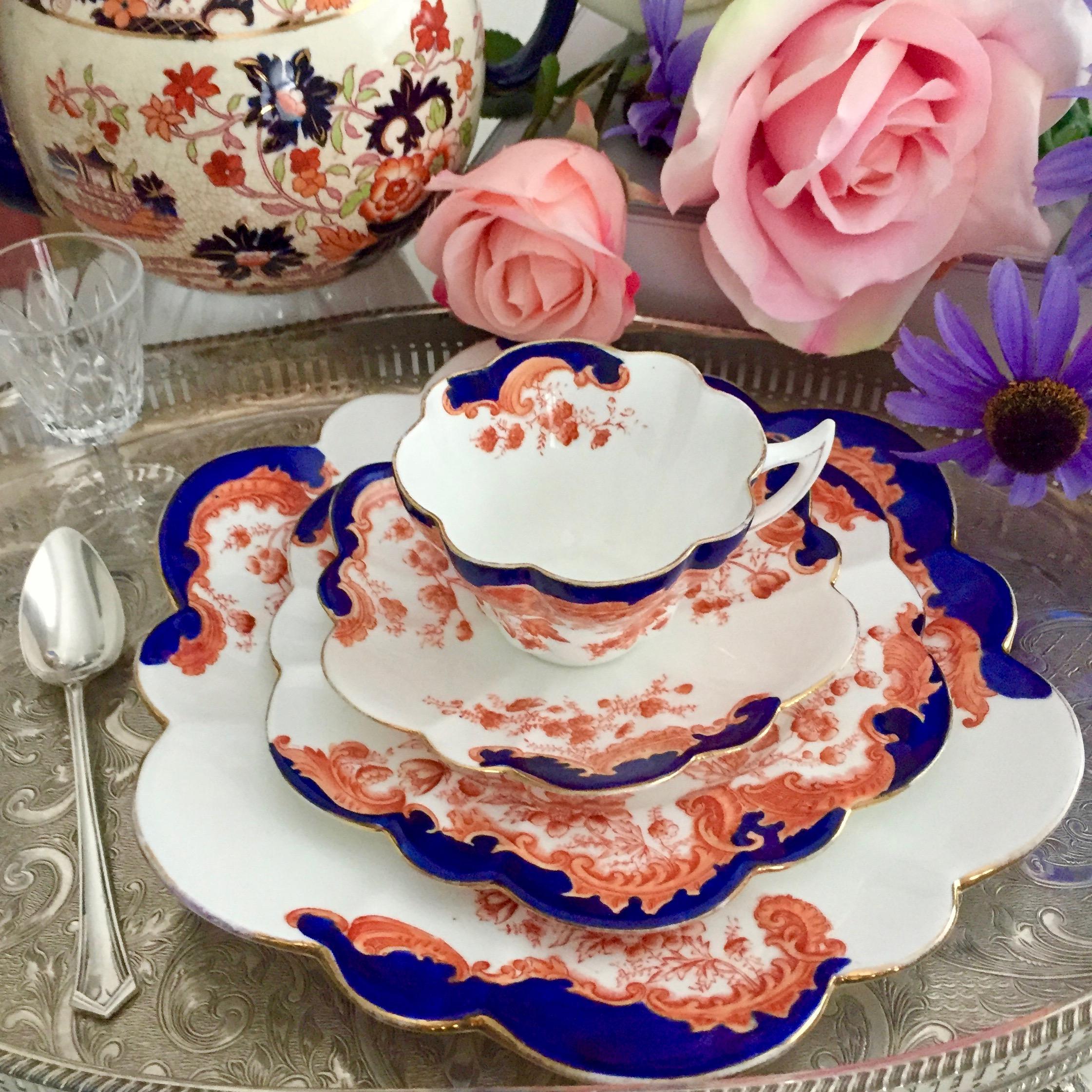 This is a porcelain teacup quartet made by Wileman & Co in 1902, which was the Art Nouveau period. It is decorated in a Japanese-inspired design. It consists of a teacup, saucer, side plate and a large cake plate. 

This is a very desired design