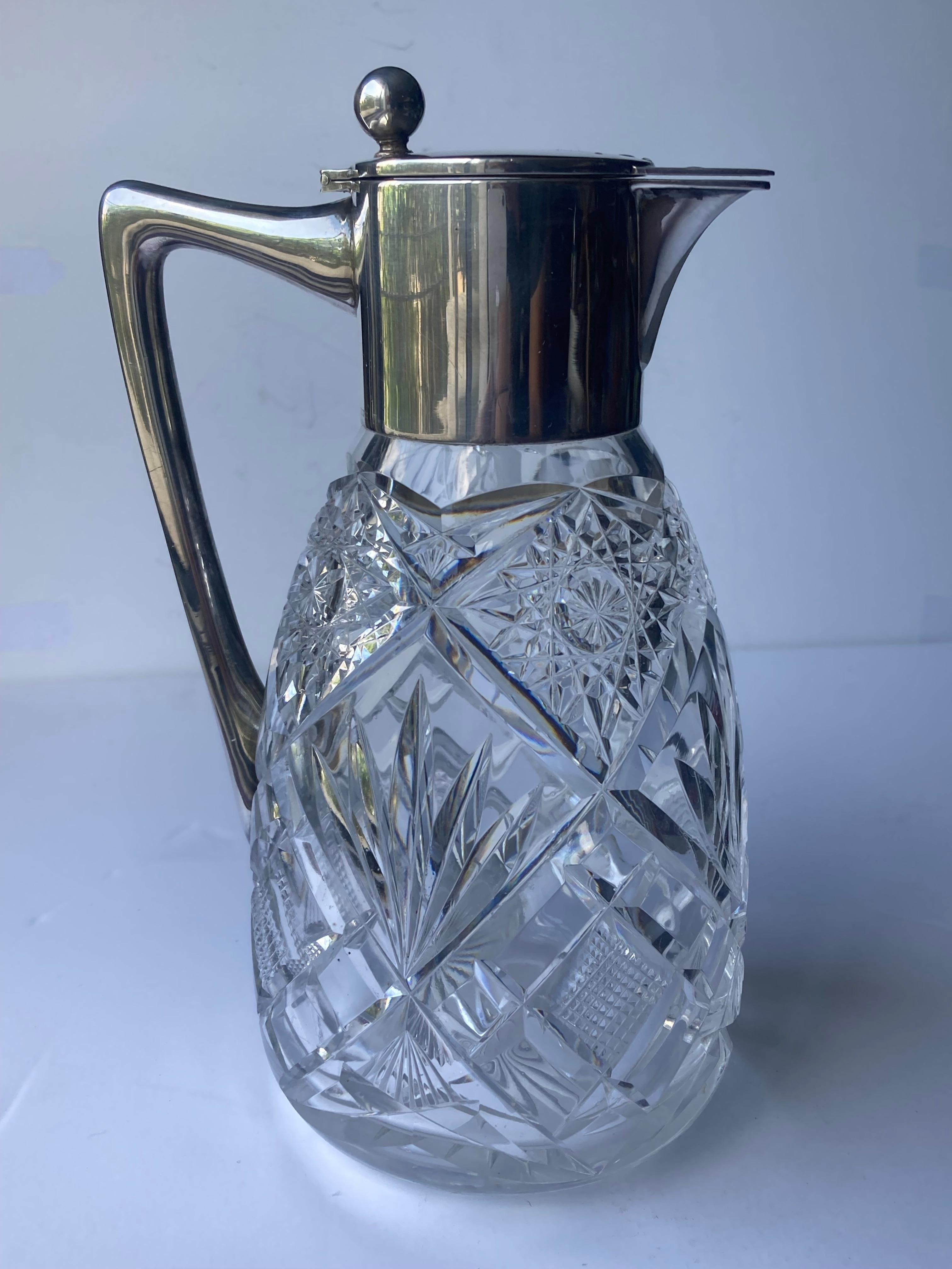 Beautiful pitcher by the very well known German Designer , Wilhelm T Binder , marked with quarter moon , crown WTB 800 and hand cut crystal bottom .