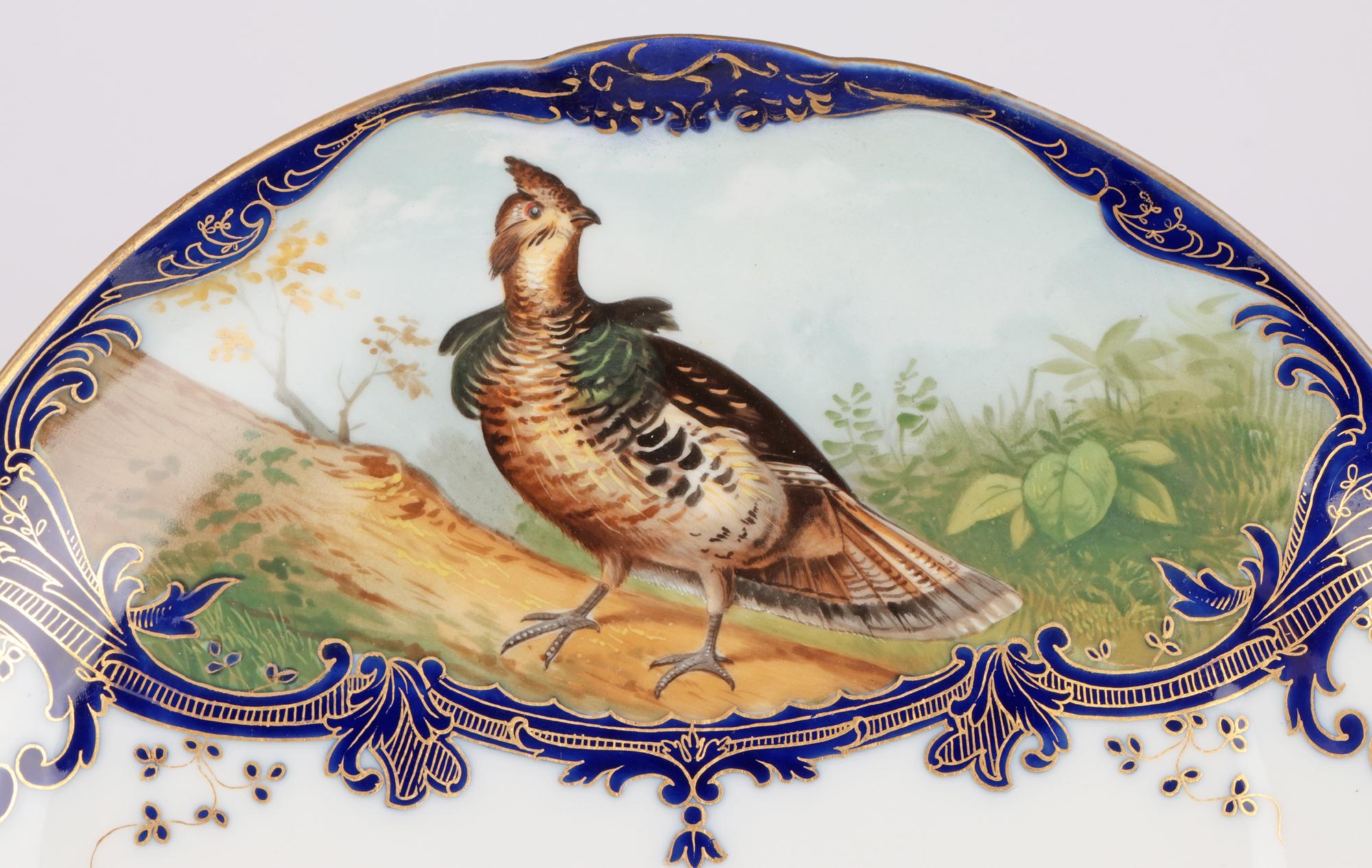 An exceptional hand painted, probably continental, porcelain cabinet plate retailed by Wilhelm & Graef New York titled ‘The Ruffed I’m After’ signed A Pope and dating from the latter 19th century. The finely made plate stands raised on a double