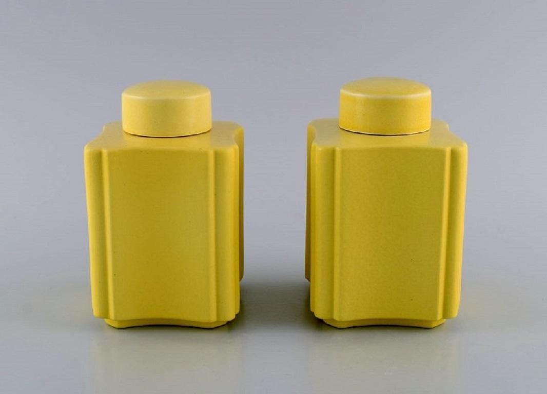 Wilhelm Kåge (1889-1960) for Gustavsberg. 
A pair of rare Art Deco tea caddies in yellow glazed stoneware. 1920s / 30s.
Measures: 14 x 9 cm.
In excellent condition.
Stamped.