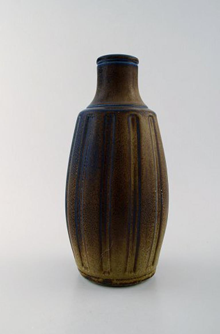 Wilhelm Kåge (1889-1960) for Gustavsberg.
Large vase of stoneware, decorated with blue or brown glaze.
Stamped.
In perfect condition.
Measures: 26 x 13.5 cm.