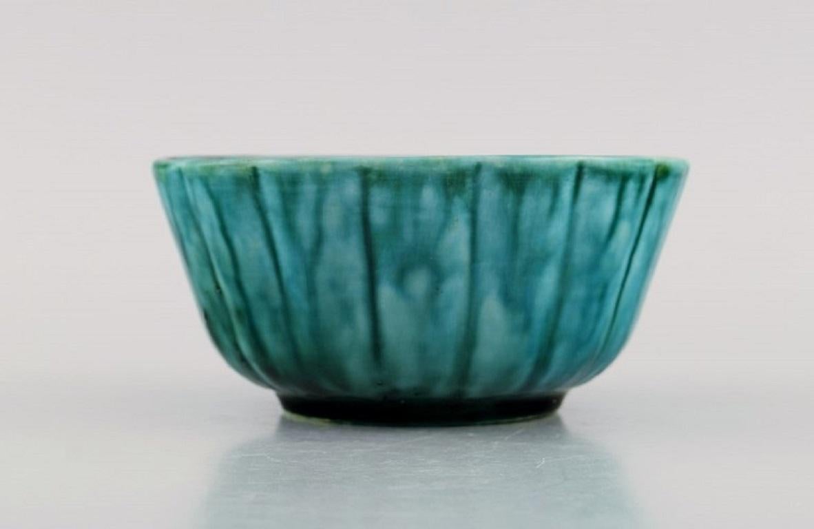 Wilhelm Kåge for Gustavsberg. Argenta Art Deco bowl in glazed ceramics. 
Beautiful glaze in shades of green. 1940's.
Measures: 12.5 x 6 cm.
In excellent condition.
Unstamped.