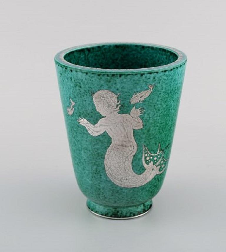 Wilhelm Kåge for Gustavsberg, Argenta Art Deco ceramic vase decorated with mermaid and fish in silver inlay, Sweden, 1940s.
Measures: 14.3 x 11.5 cm.
Stamped: Gustavsberg, Kåge.
In excellent condition.
 