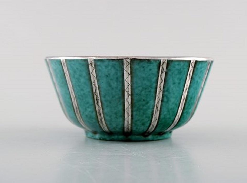 Wilhelm Kåge for Gustavsberg. Argenta bowl in glazed ceramics with silver inlaid, Sweden, 1940s.
Measures: 11 x 5.5 cm.
Stamped: Gustavsberg, Kåge.
In very good condition.
 