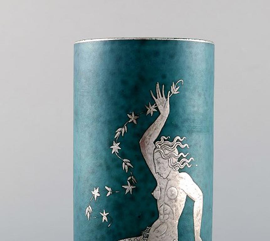 Wilhelm Kåge for Gustavsberg. Argenta vase in ceramic decorated with mermaid in silver inlaid. Sweden, 1940s.
Measures: 21.5 x 8 cm.
Stamped: Gustavsberg, Kåge.
In perfect condition.
