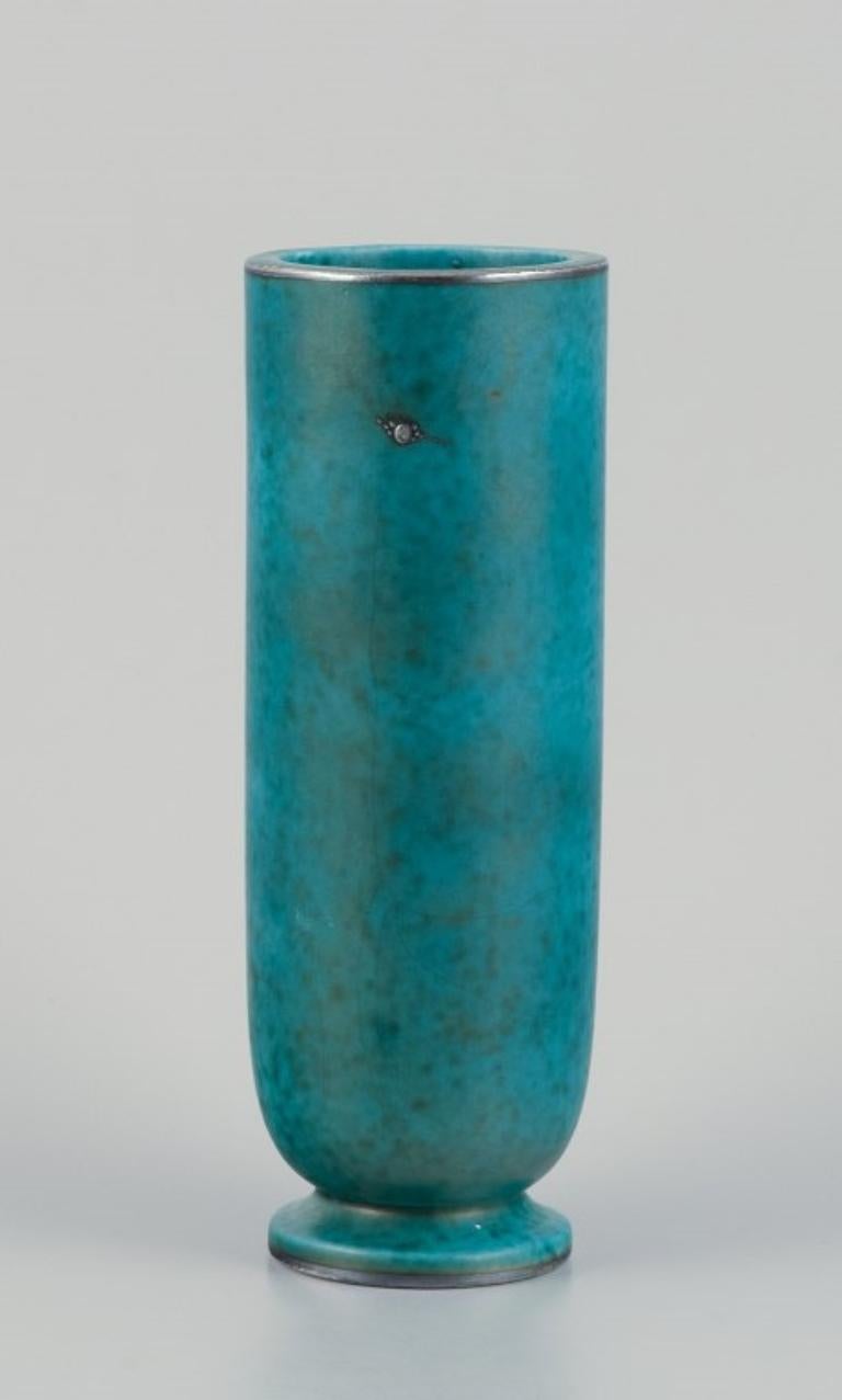 Mid-20th Century Wilhelm Kåge for Gustavsberg. Art Deco ceramic vase with silver decoration.