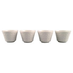Wilhelm Kåge pour Gustavsberg, quatre cache-pots en porcelaine, années 1960