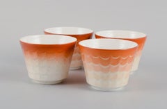 Wilhelm Kåge for Gustavsberg. Four flower pot covers in porcelain.