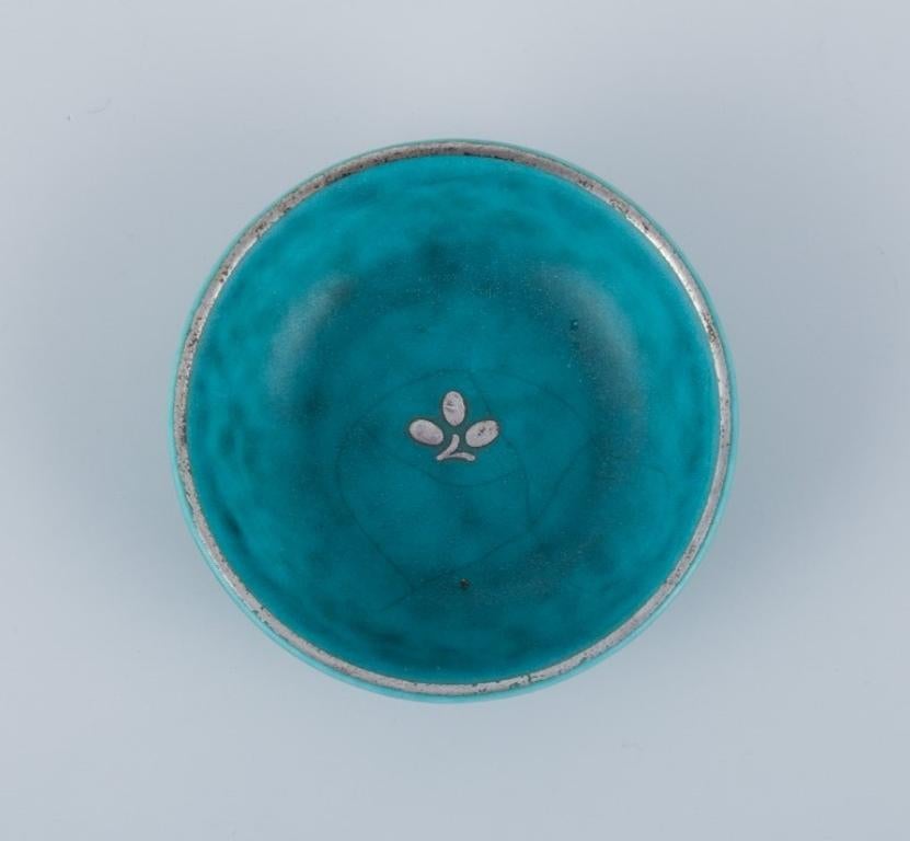 Swedish Wilhelm Kåge for Gustavsberg. Four small Argenta ceramic bowls with silver inlay For Sale