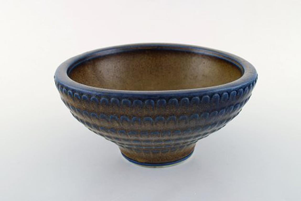 Wilhelm Kåge (1889-1960) for Gustavsberg.
Large bowl of stoneware, decorated with brown and blueish glaze.
Stamped. Gustavsberg Kåge Verkstad.
In perfect condition.
Measures: 20.5 cm x 10.5 cm.