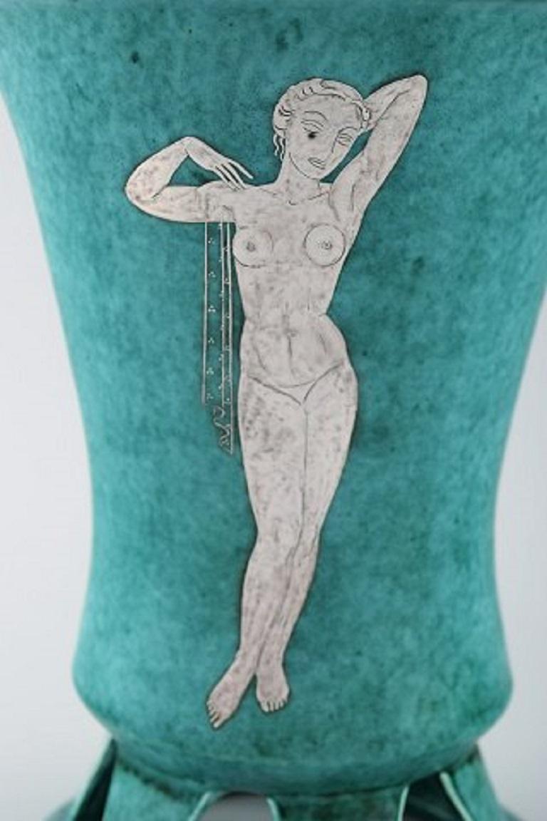 Wilhelm Kåge for Gustavsberg. Large rare Argenta Art Deco vase in glazed ceramics decorated with a naked woman in the silver inlay, 1940s.
Measures: 23 x 17.5 cm.
In perfect condition.