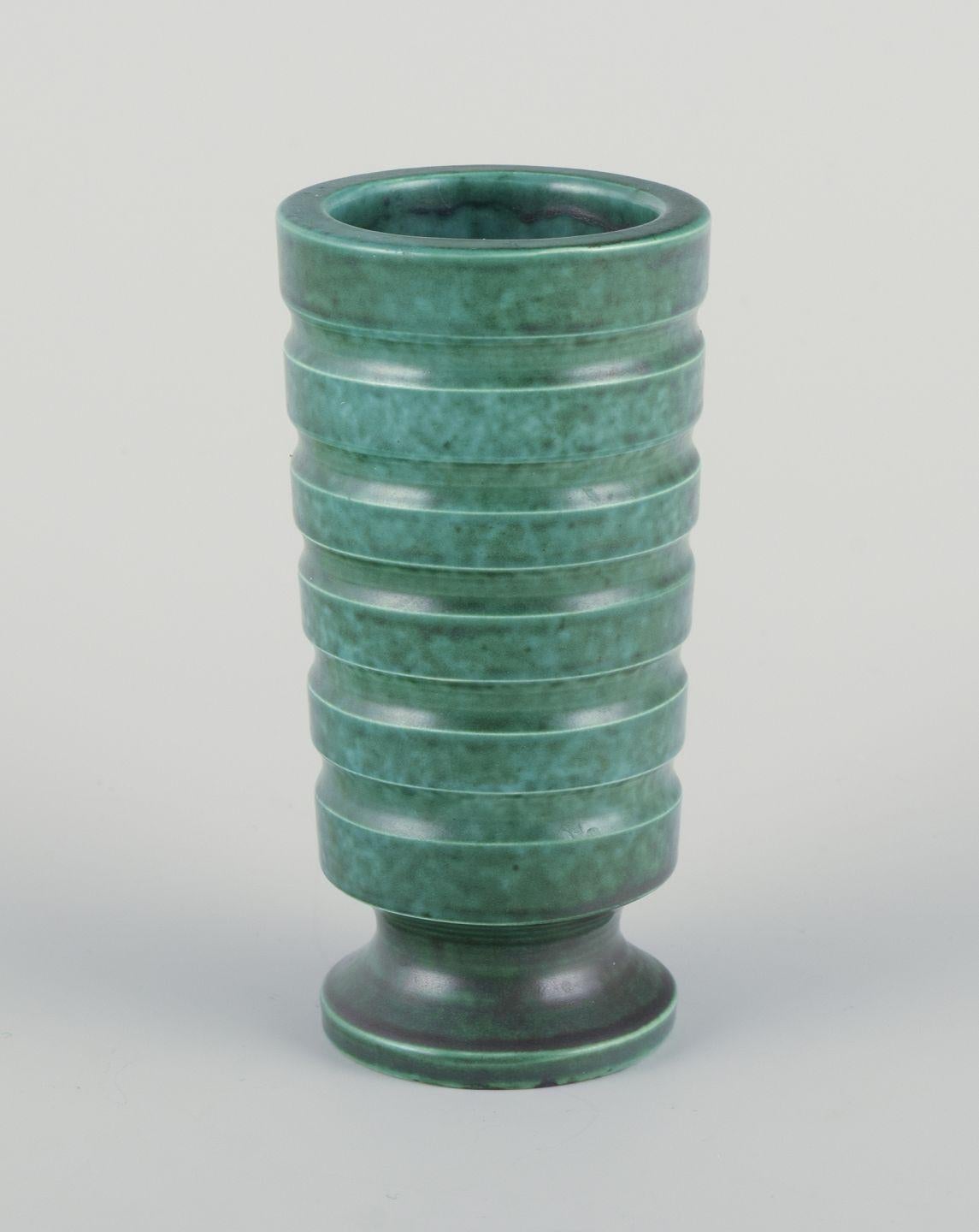 Pre-owned goods are exempt from import duties for U.S. customers. 
Therefore, no import tariffs will be applicable to your purchase.

Wilhelm Kåge for Gustavsberg, Sweden.
A pair of rare Art Deco ceramic vases in grooved design.
Hand-turned,