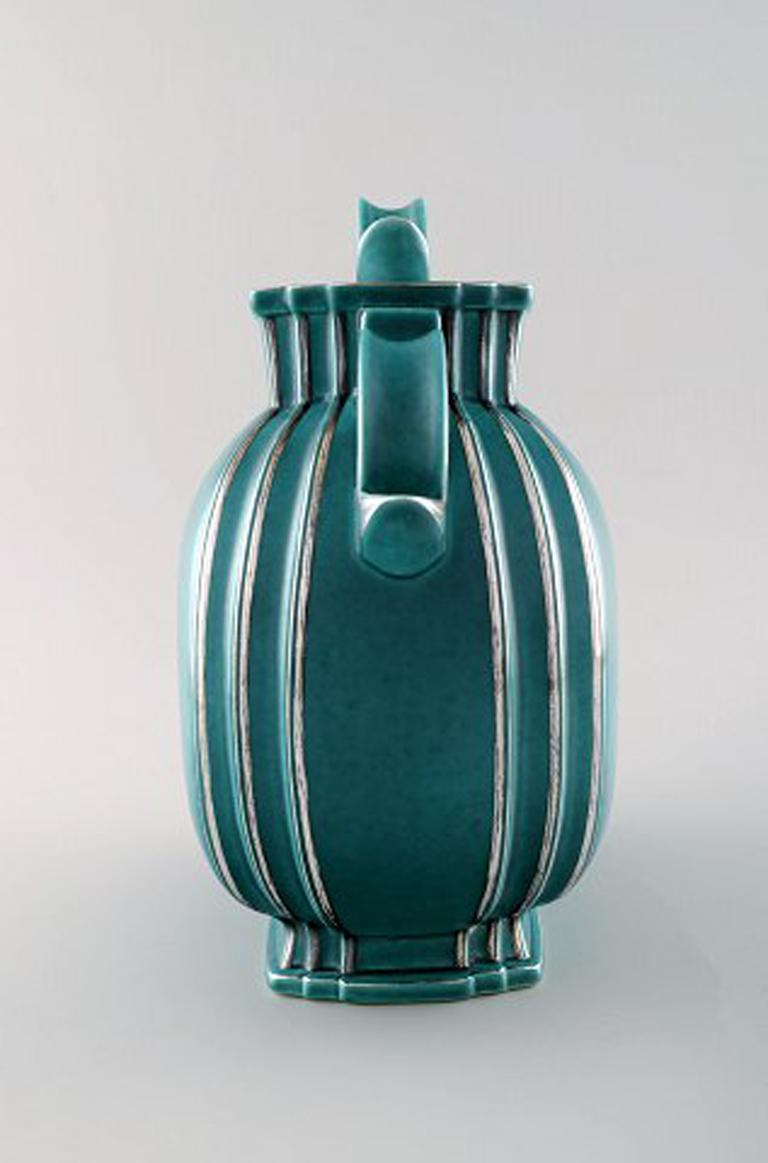 Wilhelm Kåge, Gustavsberg, Argenta Art Deco ceramic vase with a lid decorated with silver inlaid.
Sweden 1940s.
Measures 25 x 25 cm.
Marked Gustavsberg, Kåge.
In perfect condition.
Model number: 935.
