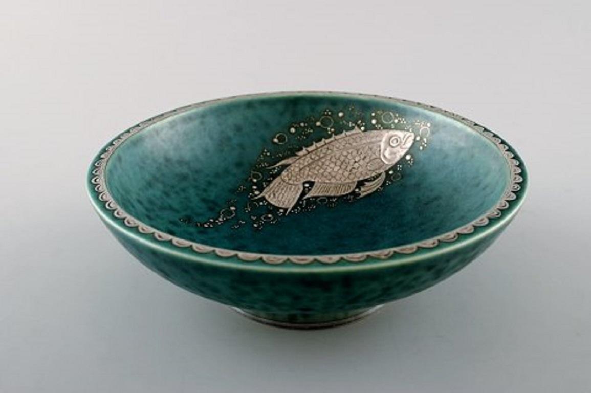 Wilhelm Kåge/Kaage, Gustavsberg, Argenta Art deco bowl decorated with fish.
Measures 15 x 5 cm.
Stamped Gustavsberg, Argenta.
In perfect condition.