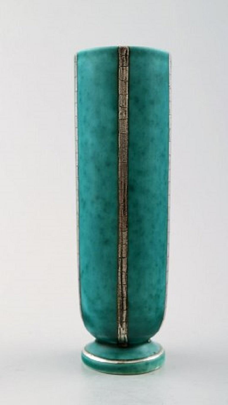 Wilhelm Kåge/Kaage, Gustavsberg, Argenta vase in ceramics, Art Deco.
Measures: 15.5 cm. x 4 cm.
Model number 1029.
Stamped Gustavsberg, Argenta.
In perfect condition.