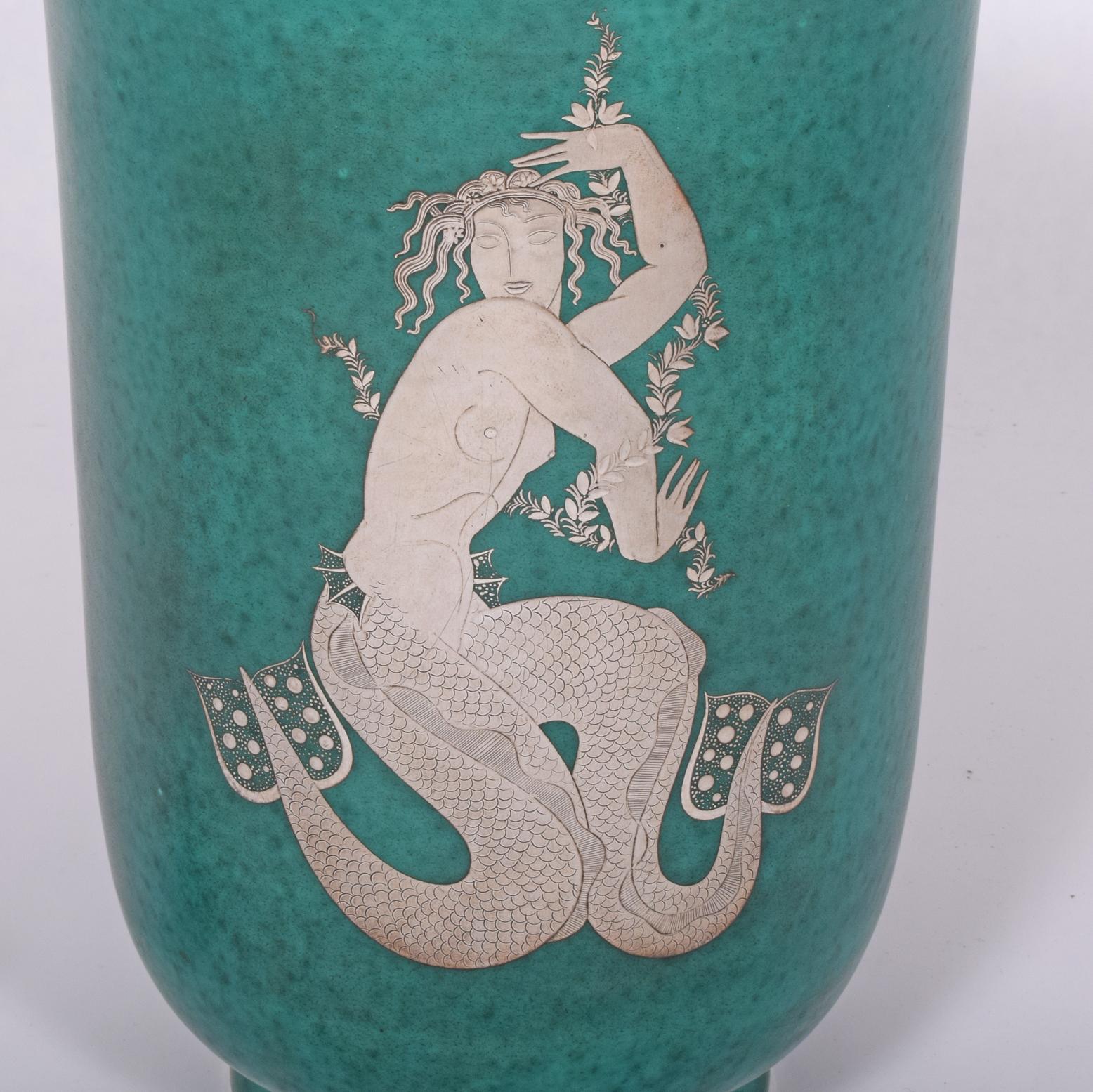 Large Argenta vase with mermaid, Sweden, 1944; Glazed stoneware, silver inlay; Manufacturer stamp/HANDDREJAD, inlaid signature GUSTAVSBERG ARGENTA 1178 JOEL OSTERBERG 1944 29/12 FRAN GUSTAVSBERGS FABRIKER with artist cipher; Measures: 13 1/2