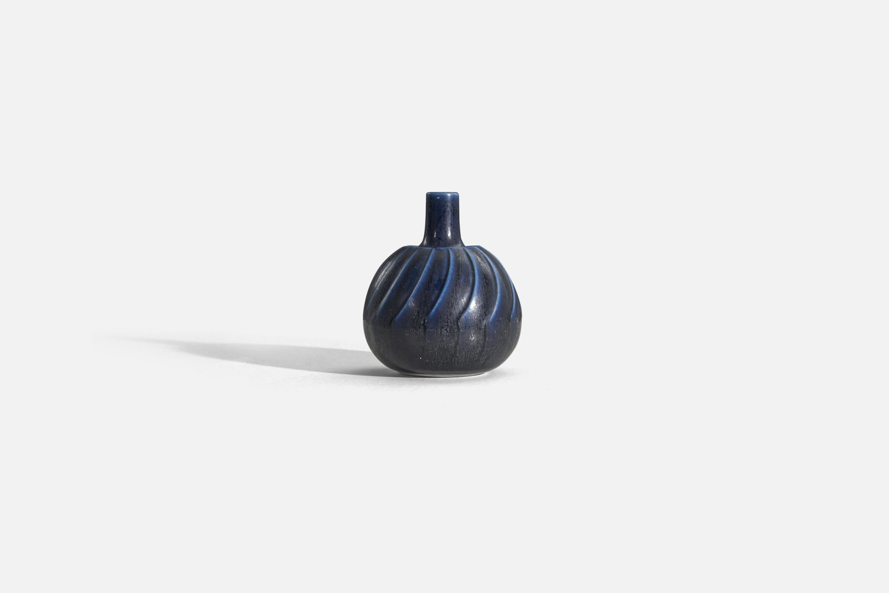 A blue-glazed stoneware vase designed by Wilhelm Kåge and produced by Gustavsberg, Sweden, c. 1960s.

