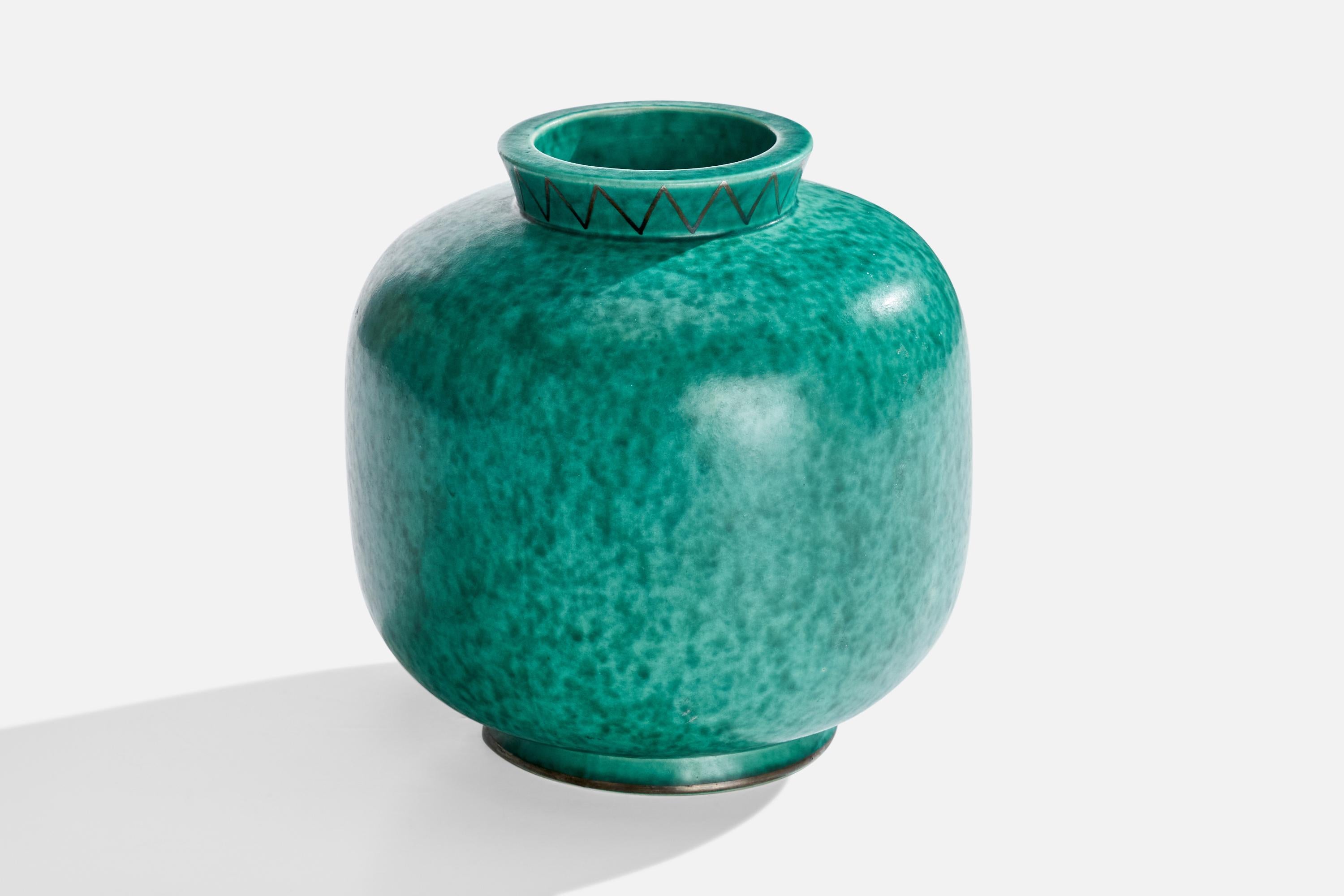 A green-glazed stoneware vase with silver paint designed by Wilhelm Kåge and produced by Gustavsberg, Sweden, c. 1950s.