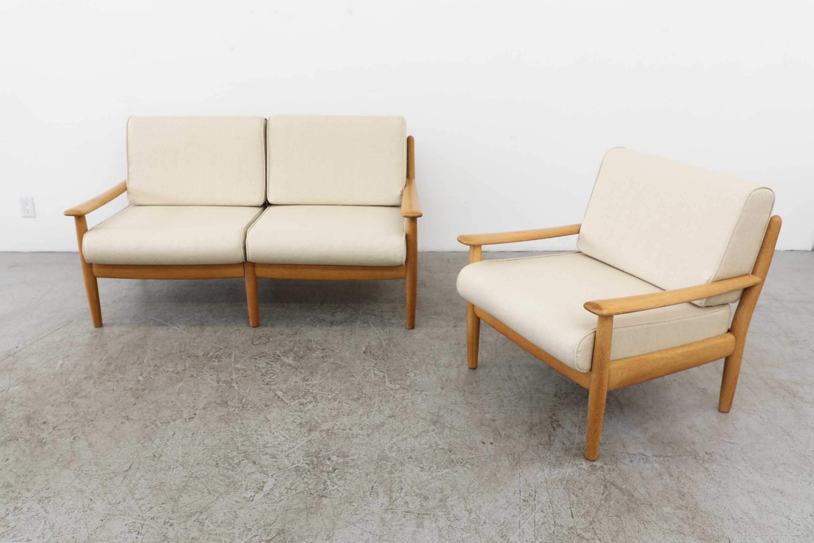Wilhelm Knoll Oak Loveseat, Germany 1960's. Clearly influenced by Borge Mogensen with the clean natural fat round oak frames and simple lines. The frame is in original condition with new cream upholstery. There is some visible wear to the frame that