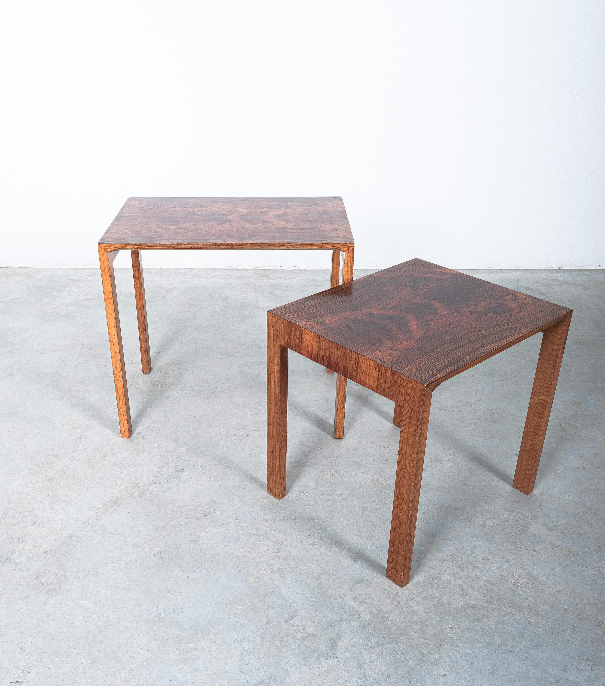 Nest of 2 tables by Wilhelm Renz table, Germany 1960

Side tables in nesting style with nice curves and beautiful rosewood veneer. Good condition, some scratches and minimal veneer losses around the edges. 
Dimensions are 23