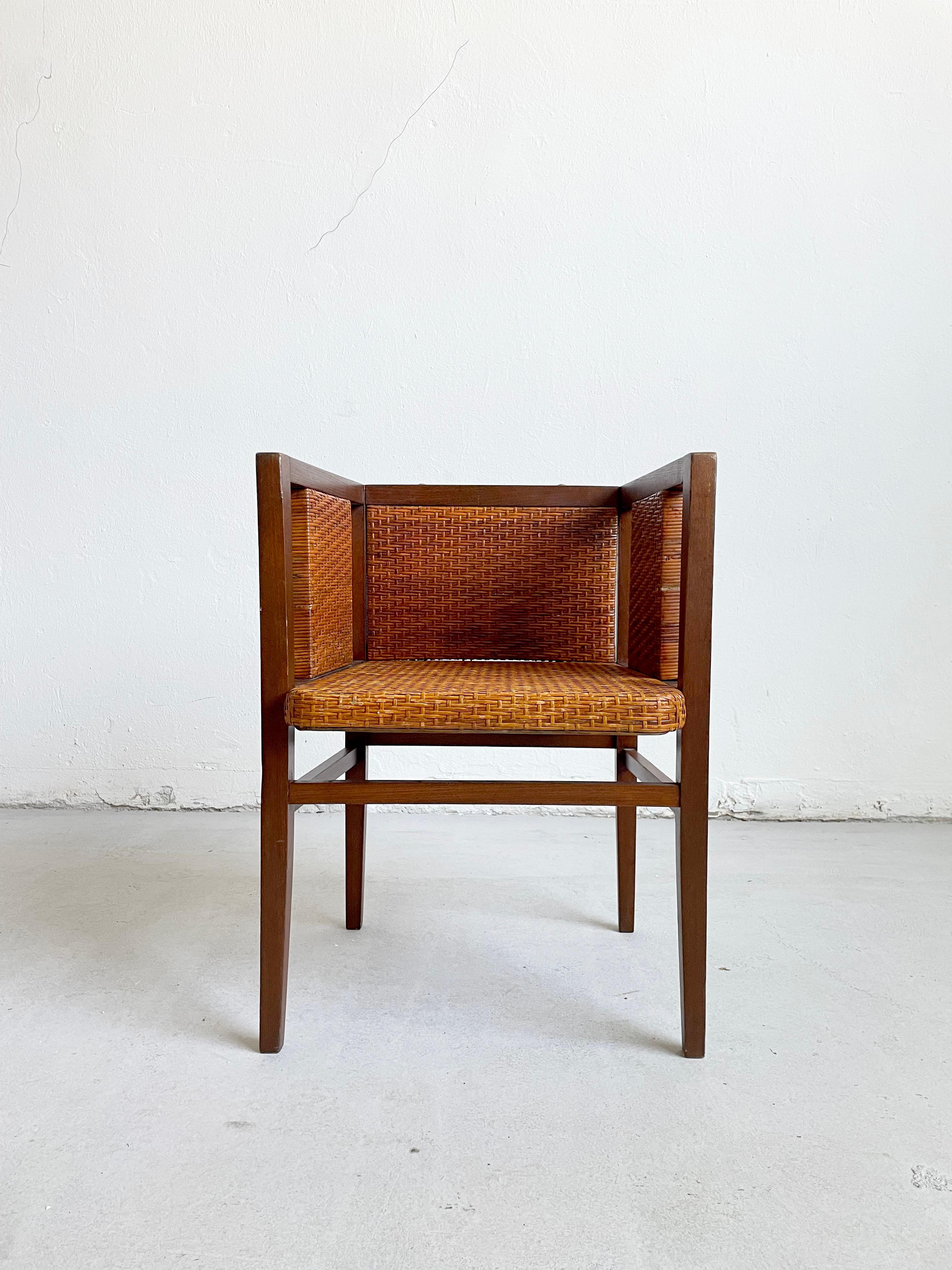 Rare original Austrian Secessionist armchair, designed by the architect and furniture designer, Wilhelm Schmidt, who studied with Joseph Hoffmann at the Wiener Kunstgewerbe. 
This rectilinear chair, made of stained oak with rattan seat, sides and