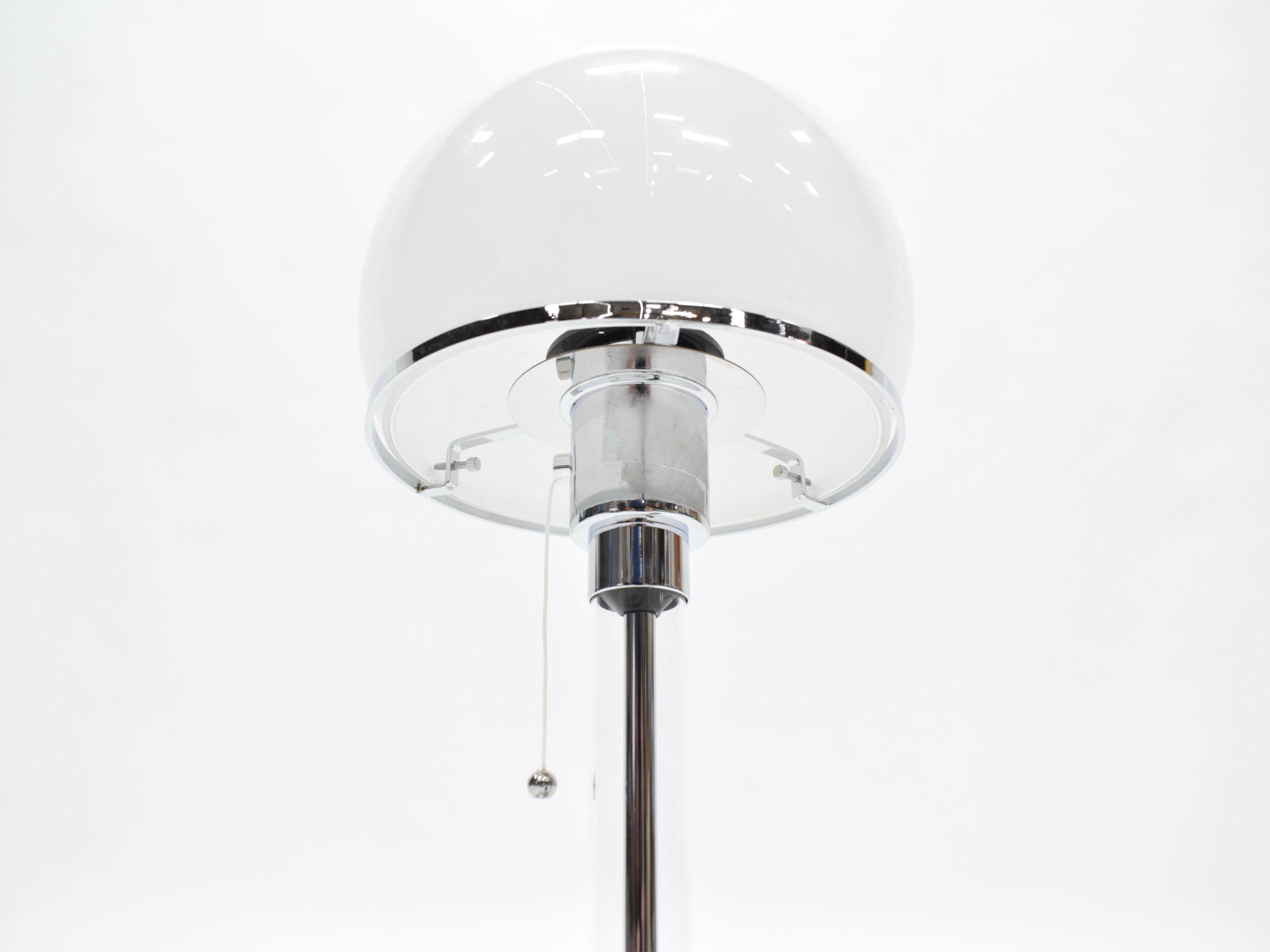 Chrome and glass Bauhaus table lamp by German designer, Wilhelm Wagenfeld, for Tecnolume in the 1920’s. The lamps have been wired for US electrical outlets, and they take regular 75w max Edison bulb.
New production and in very good