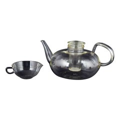 Wilhelm Wagenfeld for Jenaer Glas. Teapot with strainer and creamer, 1930s.