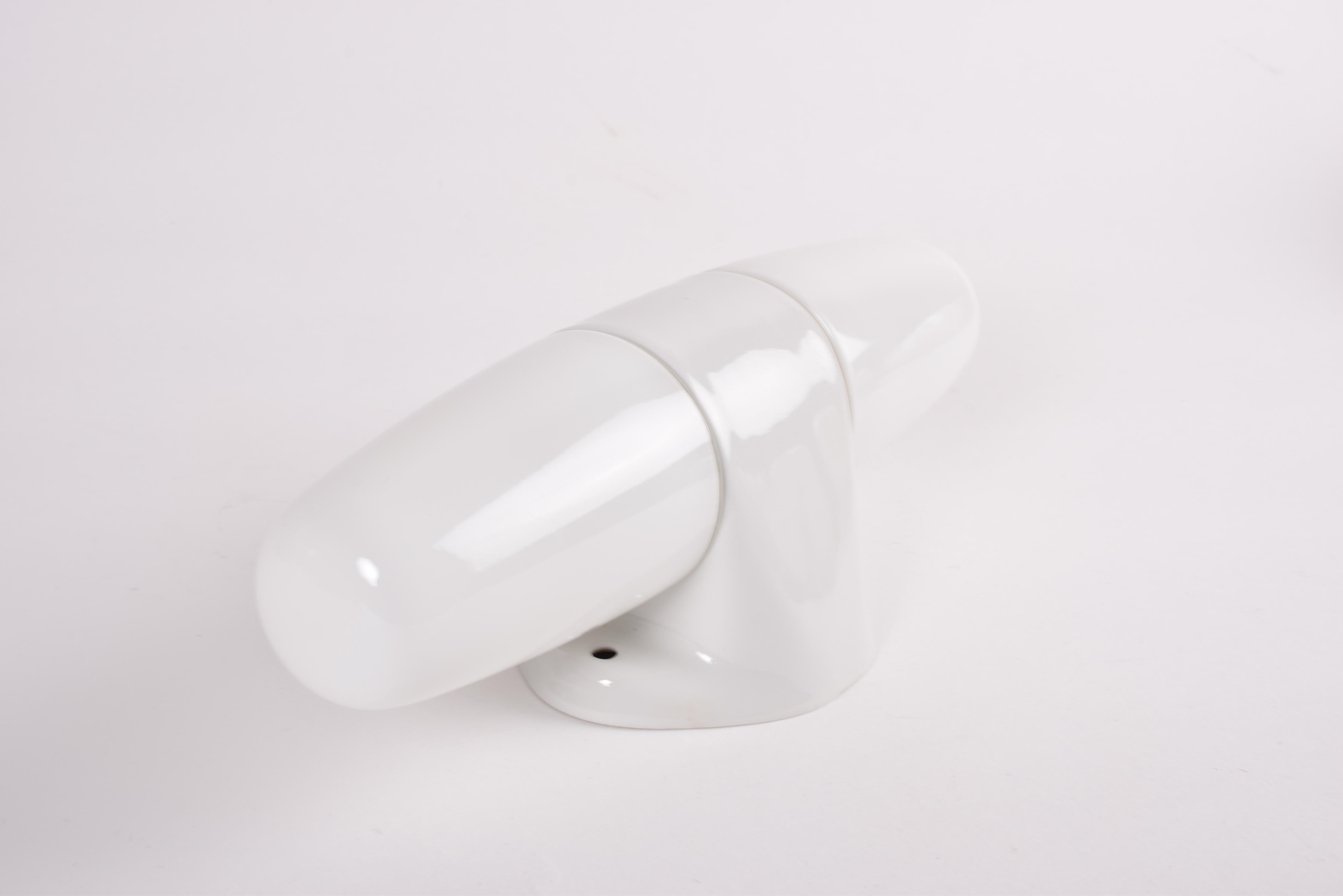 Original vintage double wall sconce by German designer Wilhelm Wagenfeld.
It was manufactured by Lindner Wandleuchten ca 1950s.

The lamp has a white glazed ceramic holder with white opaline glass.

The lamp is marked with model number 6068.

Use