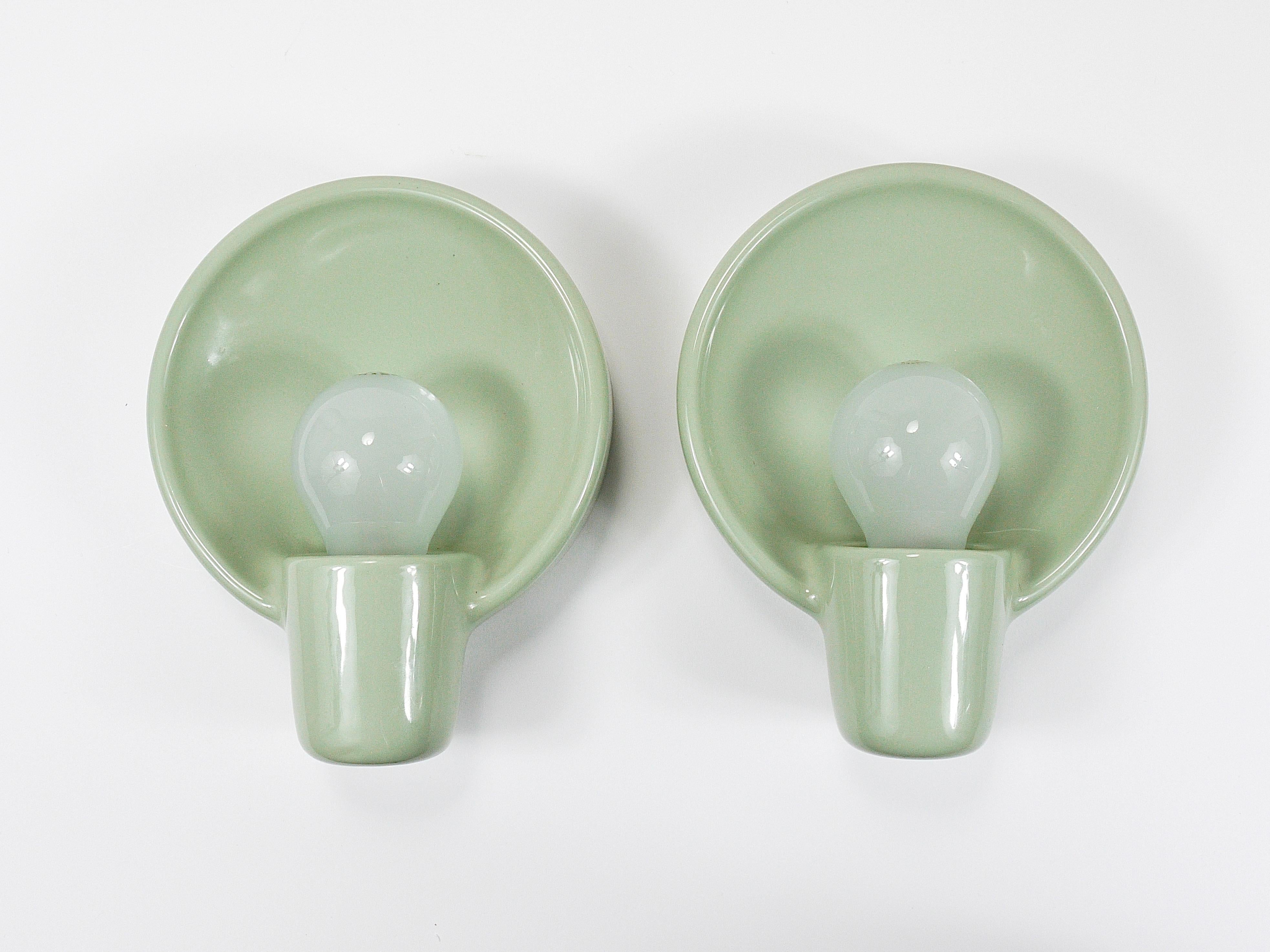 Up to three stunning round Mid-Century wall lights from the 1950s, sold and priced individually. Designed by Professor Wilhelm Wagenfeld and produced by Linder Wandleuchten in Bamberg, Germany.
Crafted from ceramic, these lights feature a lovely