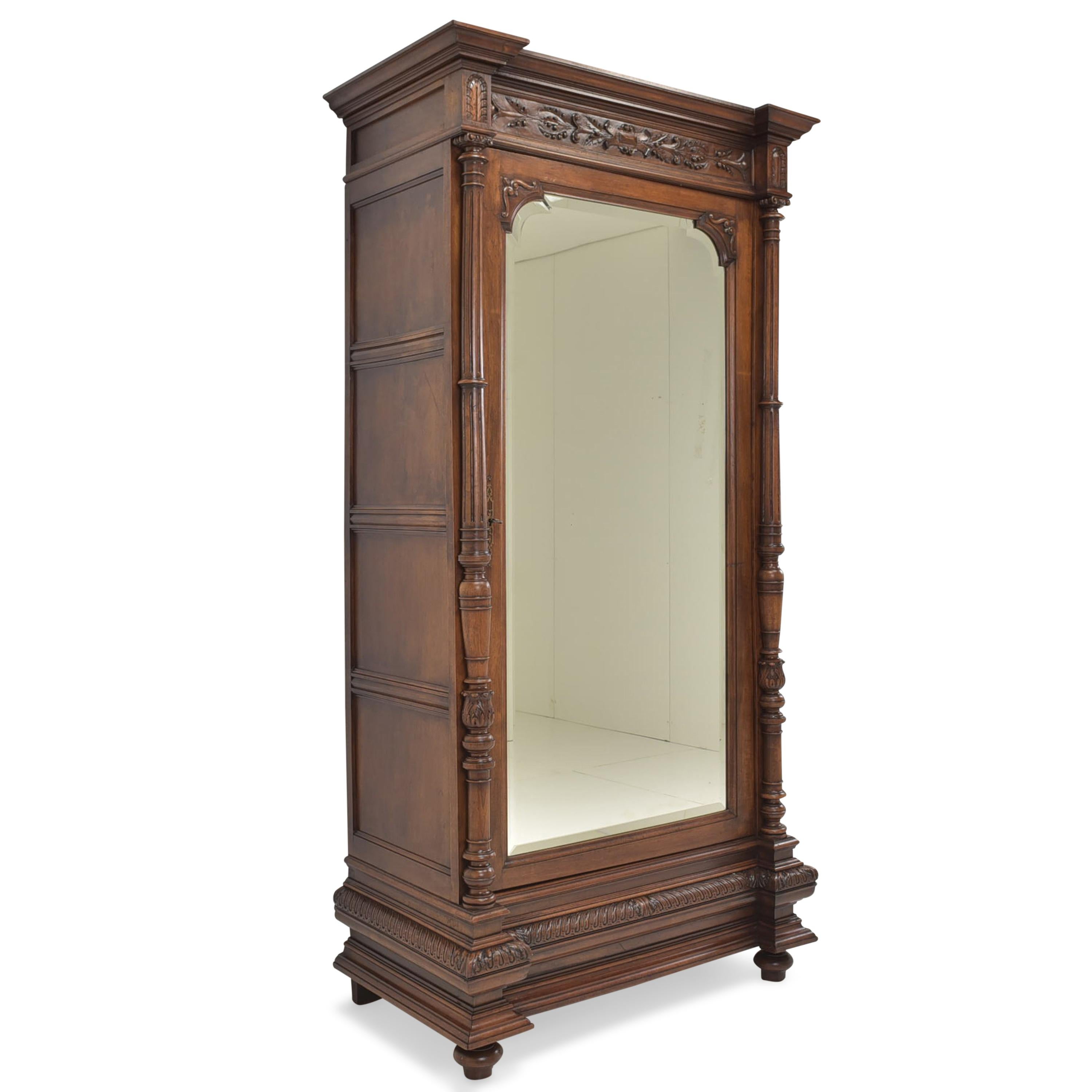 One-door wardrobe restored Wilhelminian walnut hallway wardrobe, 1890

Features:
Completely solid wood (except for mirror cover inside)
Solid walnut body, solid oak inside
Single-door model with mirror and three shelves
High quality
Solid oak