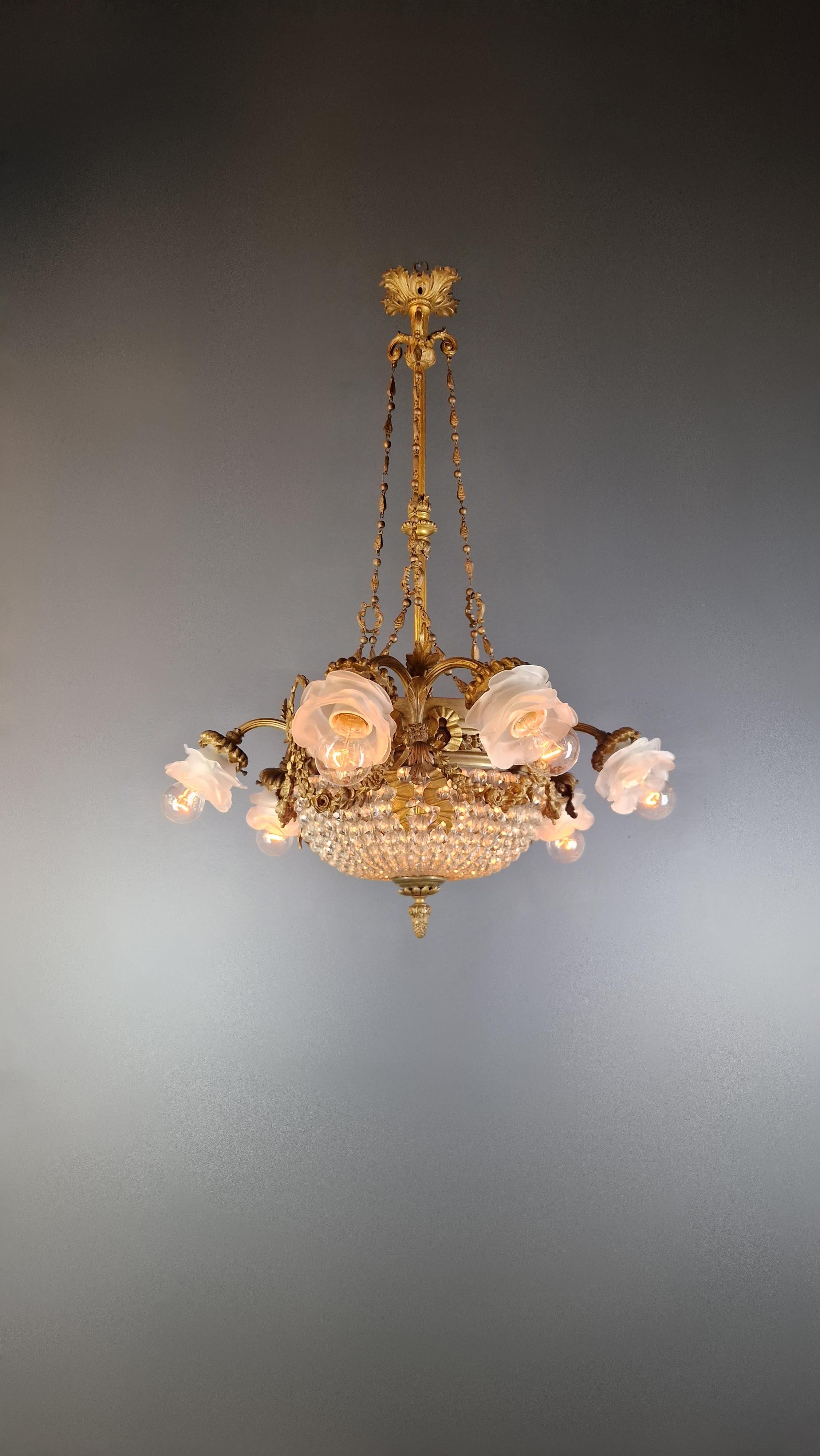 Elegant antique chandelier: a testament to craftsmanship and grace

Experience the revived splendor of the past in our meticulously restored vintage chandelier, a true masterpiece that embodies the pinnacle of Art Nouveau design. With the greatest