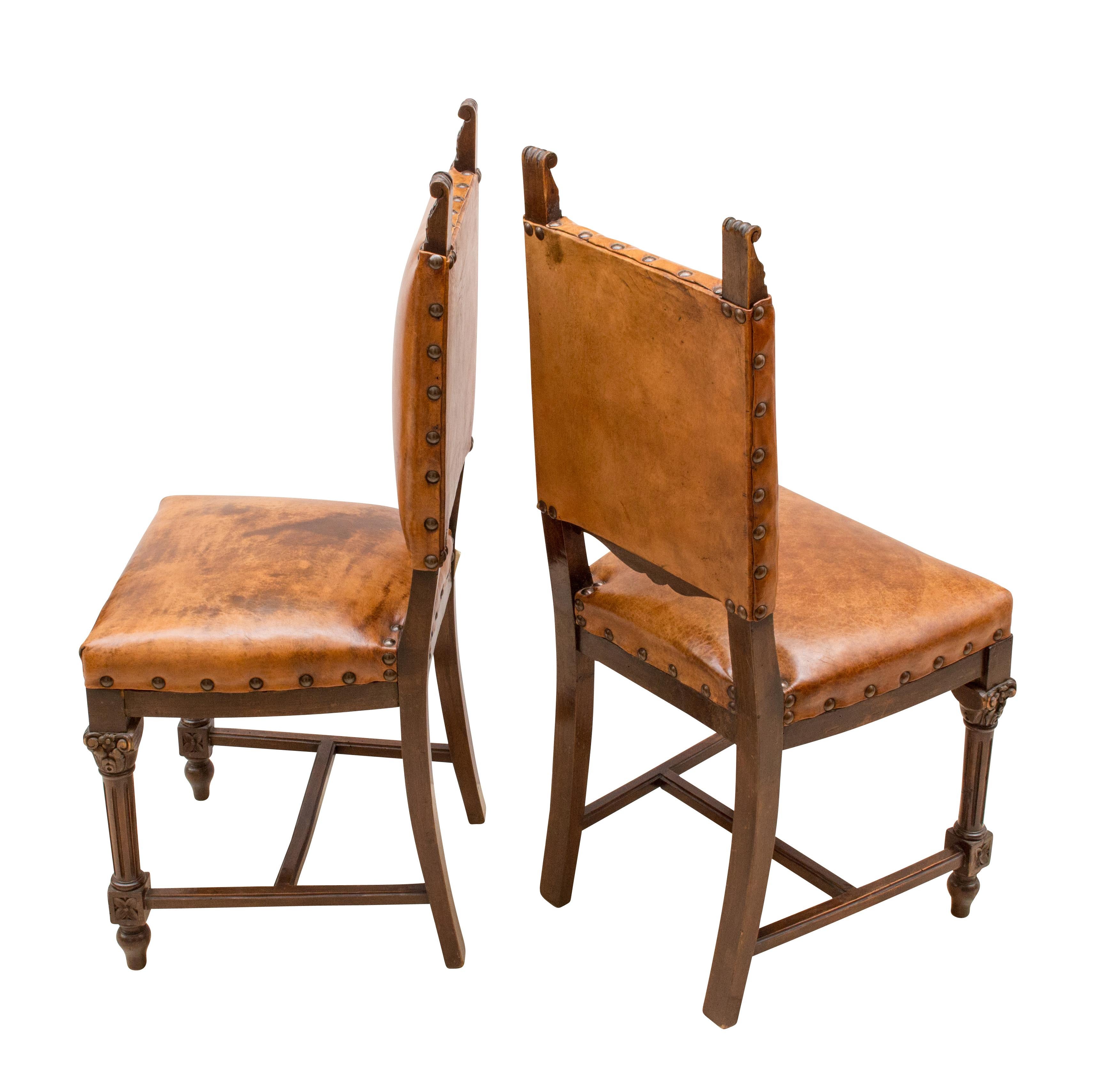 Two leather chairs from the time of 1870 (Gründerzeit) made of walnut and upholstered and covered with sheep leather. The leather is hand patinated.