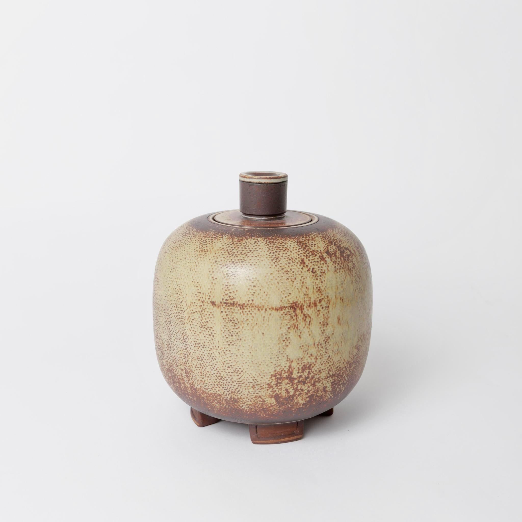 Farsta glazed stoneware lidded urn by artist Wilhem Kage for Gustavsberg in Sweden. Signed by the artist.
Wilhelm Kage’s Farsta set comprises his most exclusive pottery artwork. The fired Farsta pieces were dipped in a bath with metal oxides which