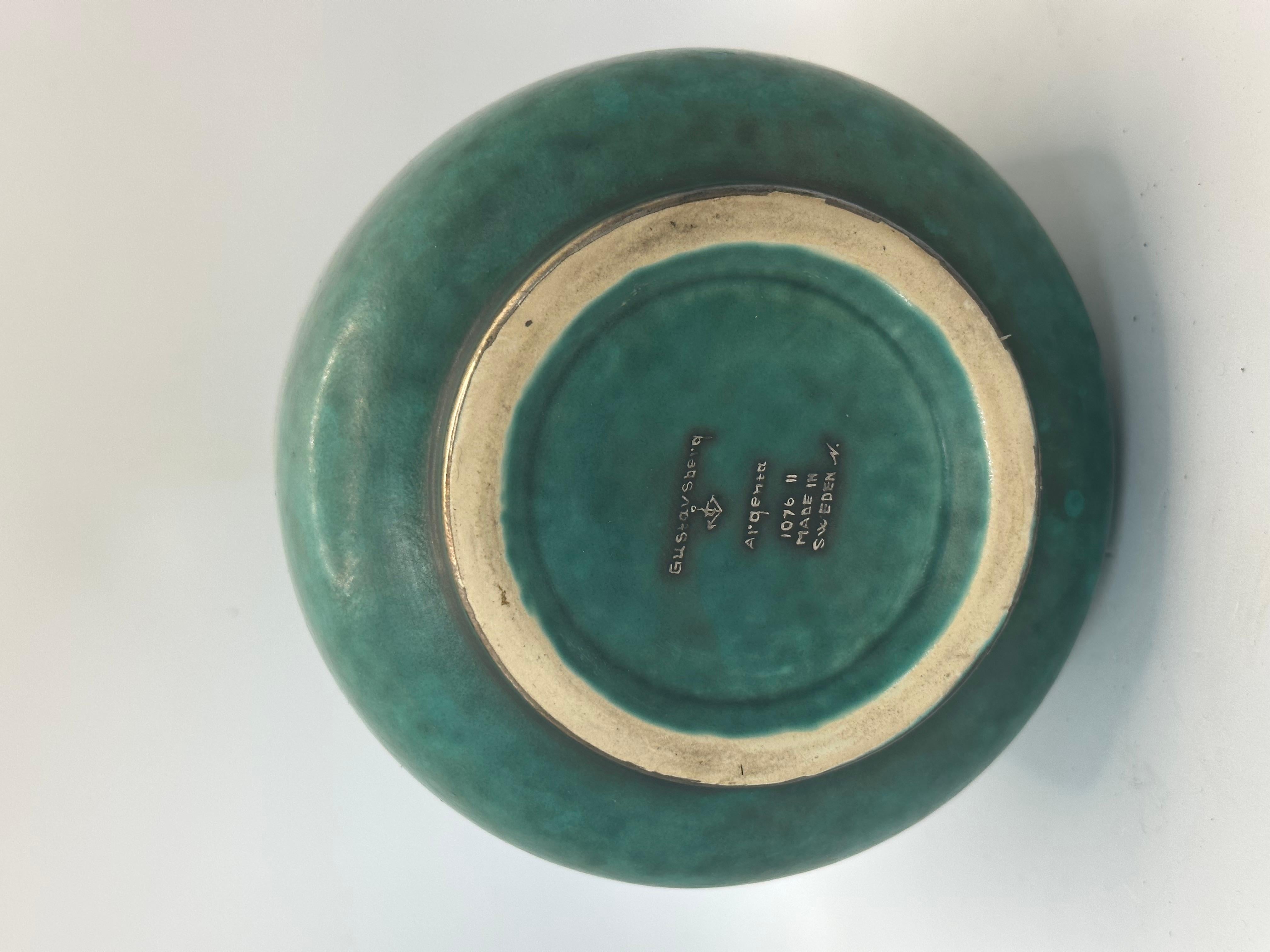 Wilhem Kage vase 'Argenta' for Gustavsberg Sweden 1950 Signed underneath 
Good condition
The Argenta sandstone collection, now emblematic with its green glaze and silver decorations, is one of Wilhelm Käge's most recognizable motifs. Designed in the