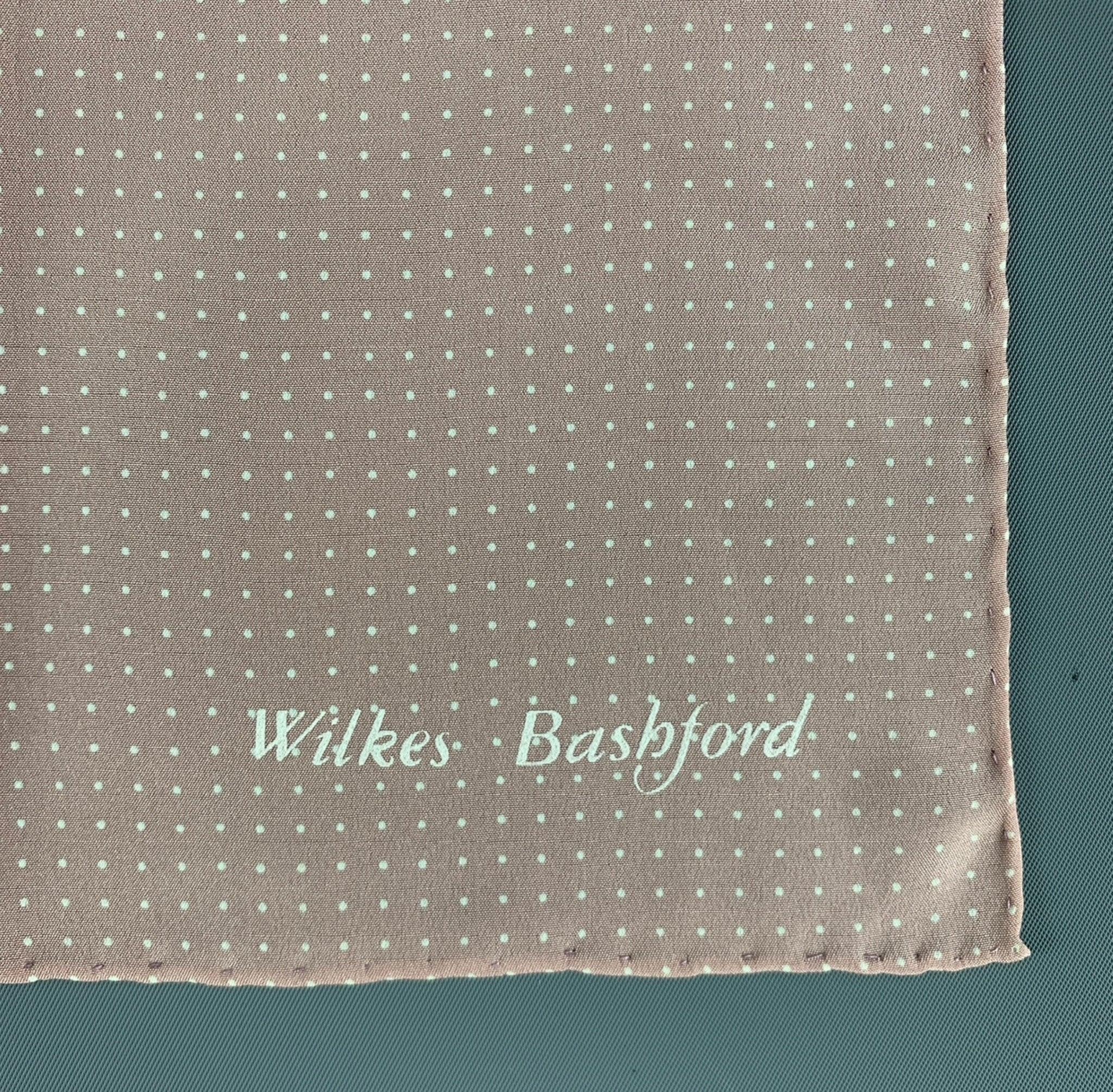 WILKES BASHFORD pocket square comes in a blush pink & white polka dotted silk satin featuring a hand rolled hem. Excellent Pre-Owned Condition. 

Measurements: 
   11 inches  x 11 inches 

  
  
 
Reference: 125458
Category: Pocket Square
More