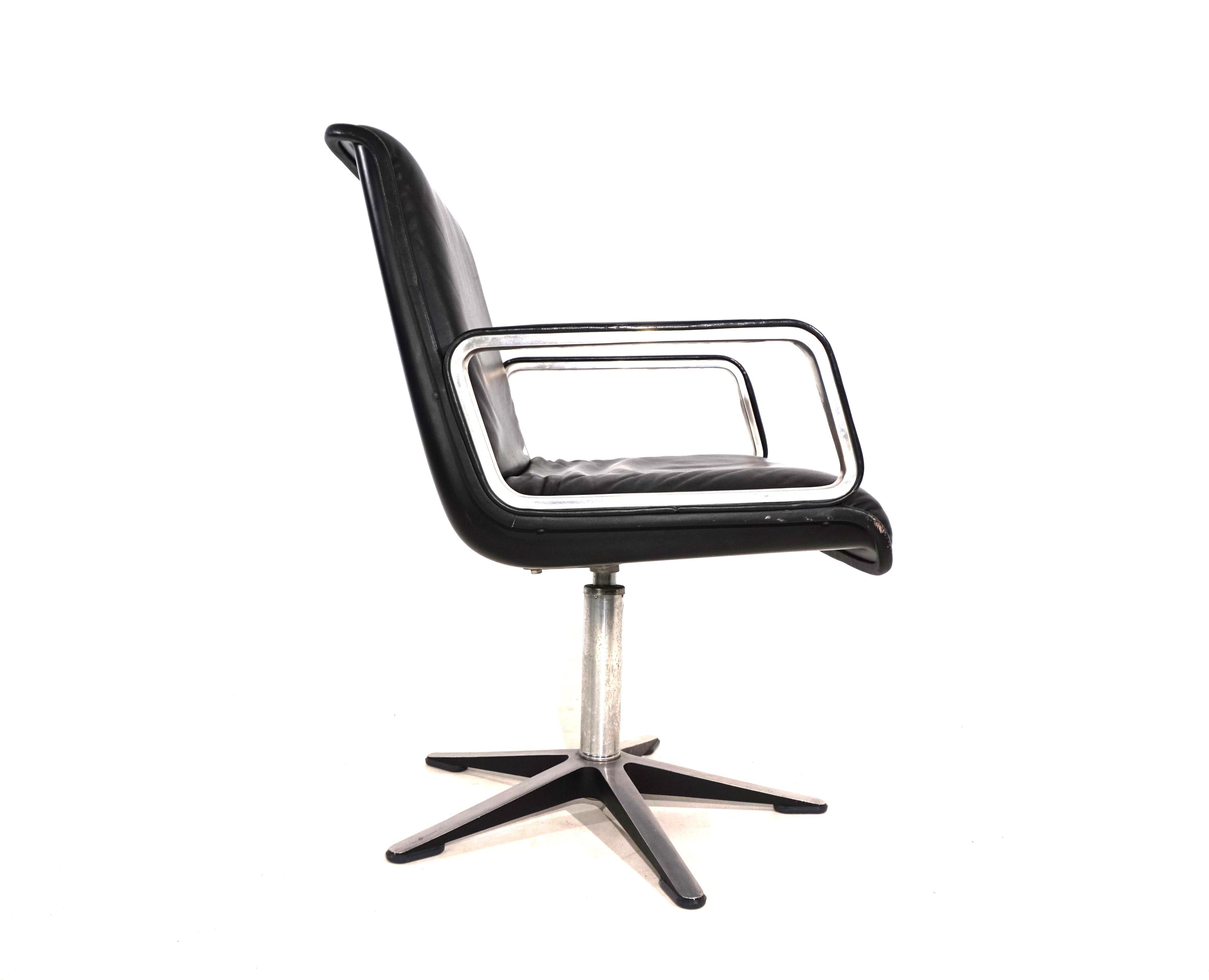A Wilkhahn Delta 2000 leather chair from the later generation with leather-covered armrests in a deep black leather tone, brushed aluminum and black shells, which is in excellent condition. The leather is flawless, the plastic shell and the aluminum