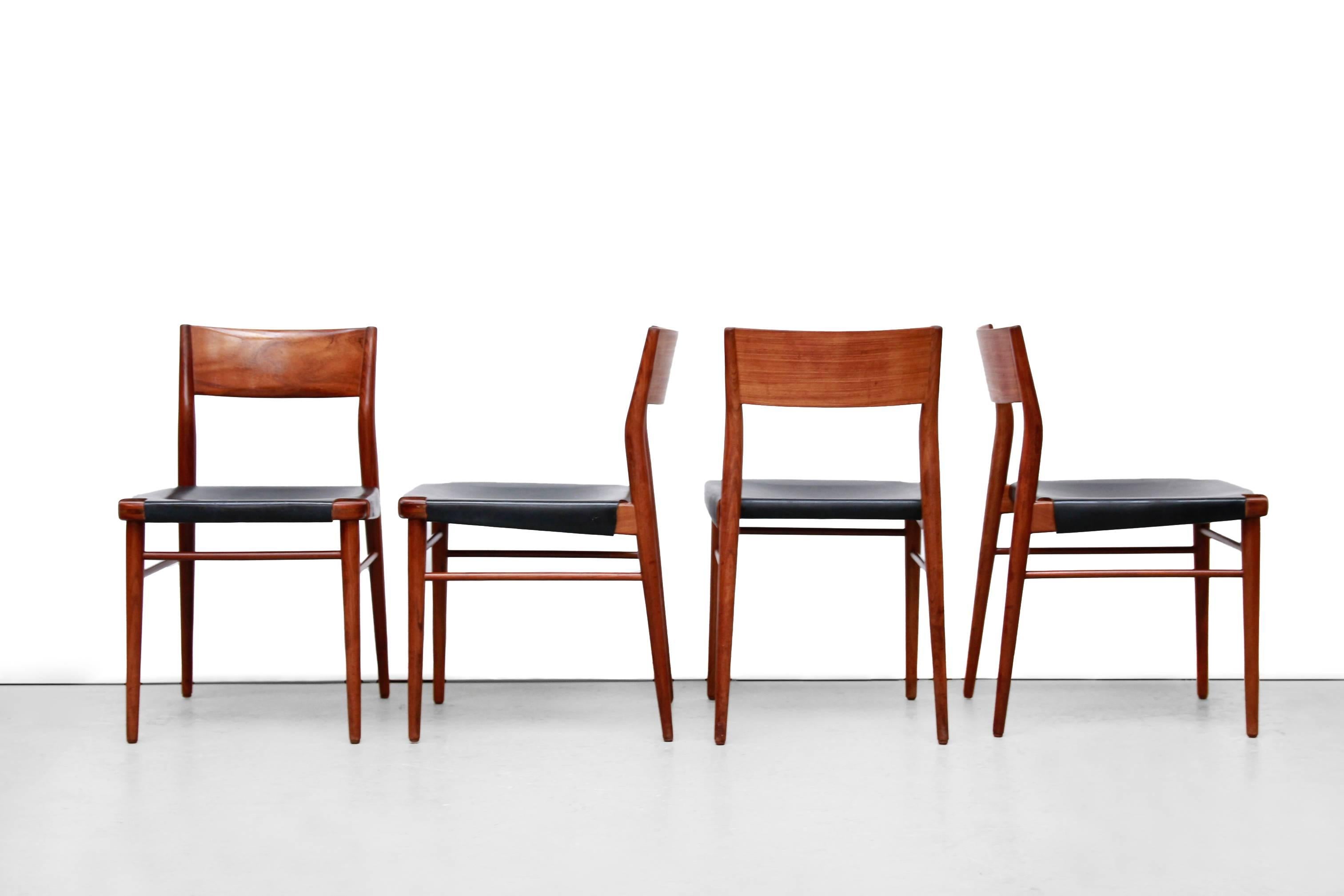 Very nice set of four dining room chairs designed by the German architect and furniture designer Georg Leowald and produced by Wilkhahn. The chairs with model name 351 are made of solid teak wood with a beautiful wood connection between the seat and