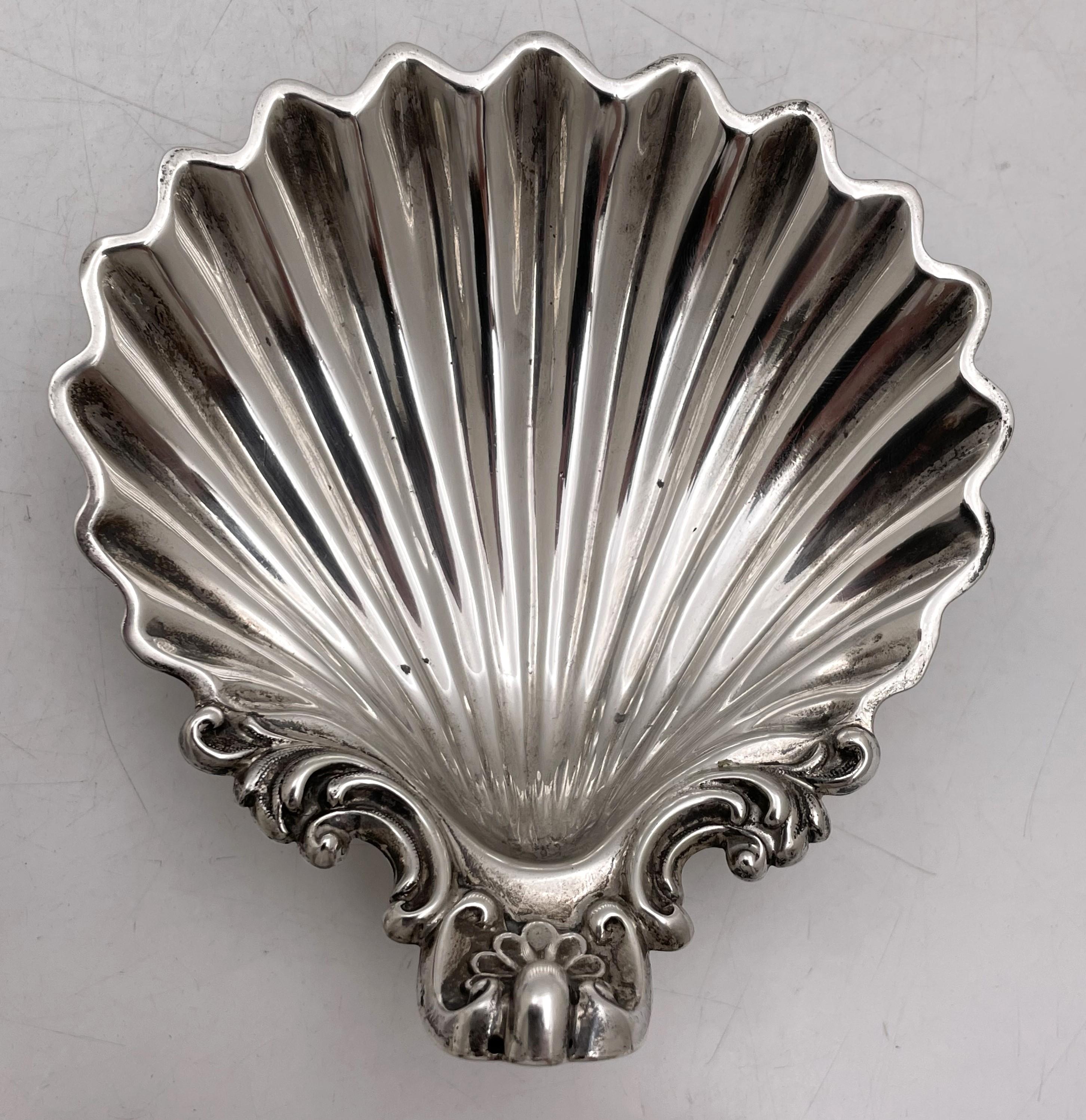 Wilkinson & Co., pair of English sterling silver shell dishes, made in Sheffield in 1872 during the Victorian era.  Exquisitely crafted and standing on 3 snail legs, they measure 5'' in length by 5'' in width by 2'' in height, weigh 9.5 troy ounces,