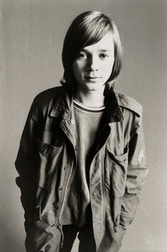 Portrait of a Standing Boy Wearing a Coat