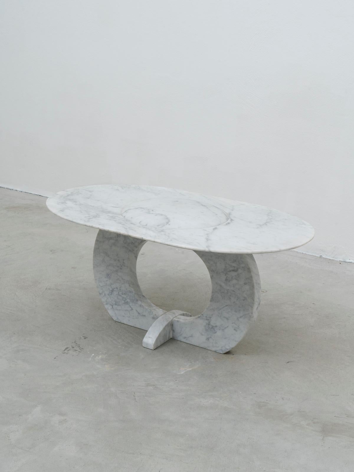 This coffee table is an unique piece by British artist Will West, living and working in Pavia, Italy. It is made of solid white Carrara marble.
This piece was exhibited during Milan Design Week 2019 in 1+1's space at Alcova. 
During his career