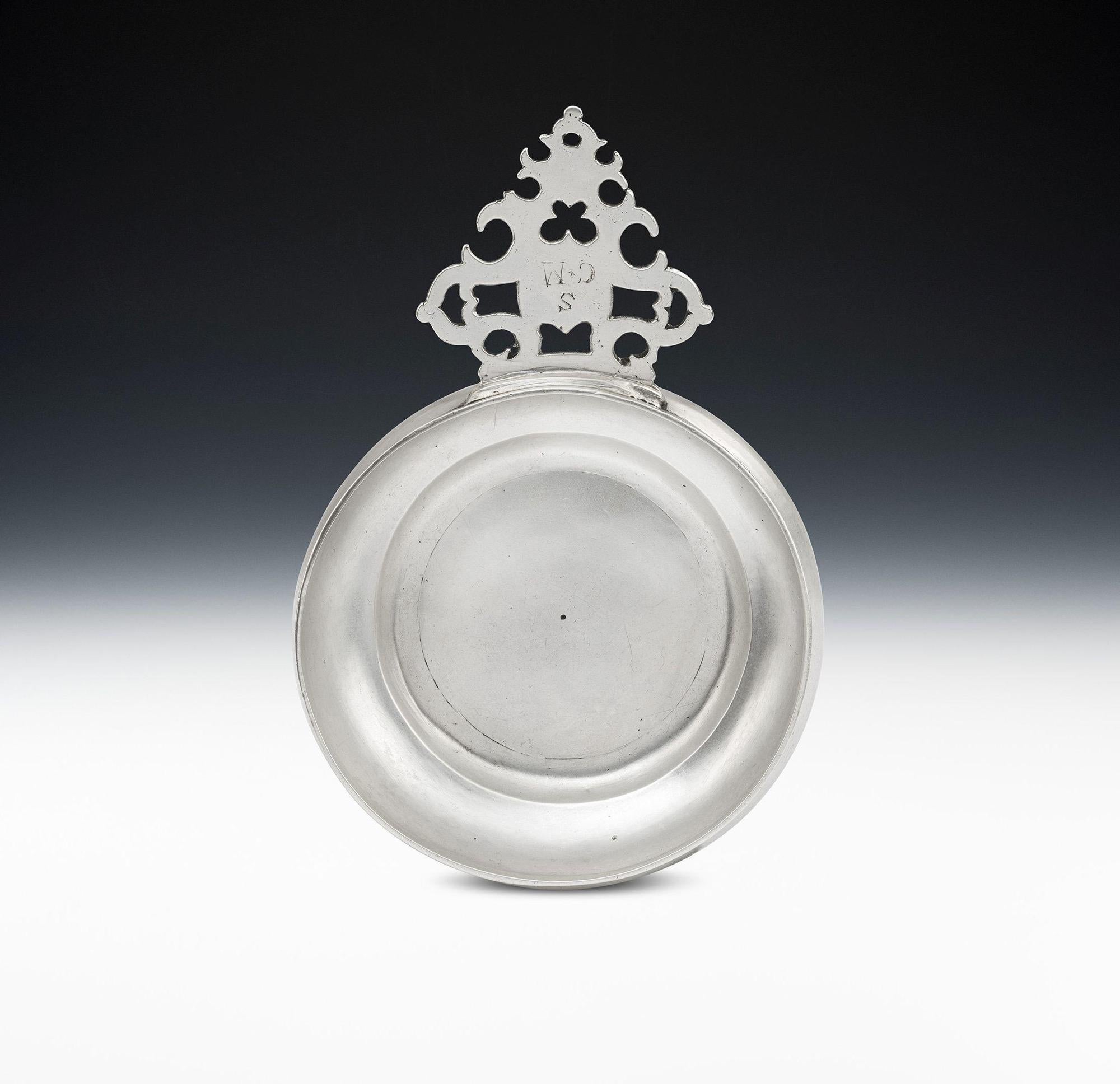 An Extremely Fine Willaim Iii Britannia Standard Side Handled Porringer Made in London in 1701 by Matthew Madden

These side handled bowls were almost certainly used as eating vessels. The bowl has circular baluster sides which rise to a straight